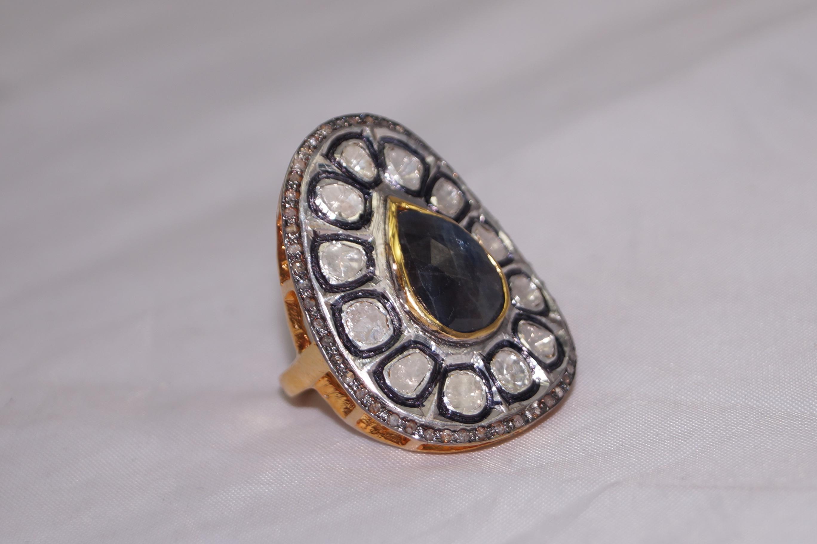 -Diamond type- Natural rose cut, natural uncut diamond

-Diamond color- white with a tint of grey

-Diamond weight- 3.60ctw

-Metal- 925 Sterling silver

Metal color- oxidized silver and yellow gold plated

Gemstone- blue sapphire (Lab created)


