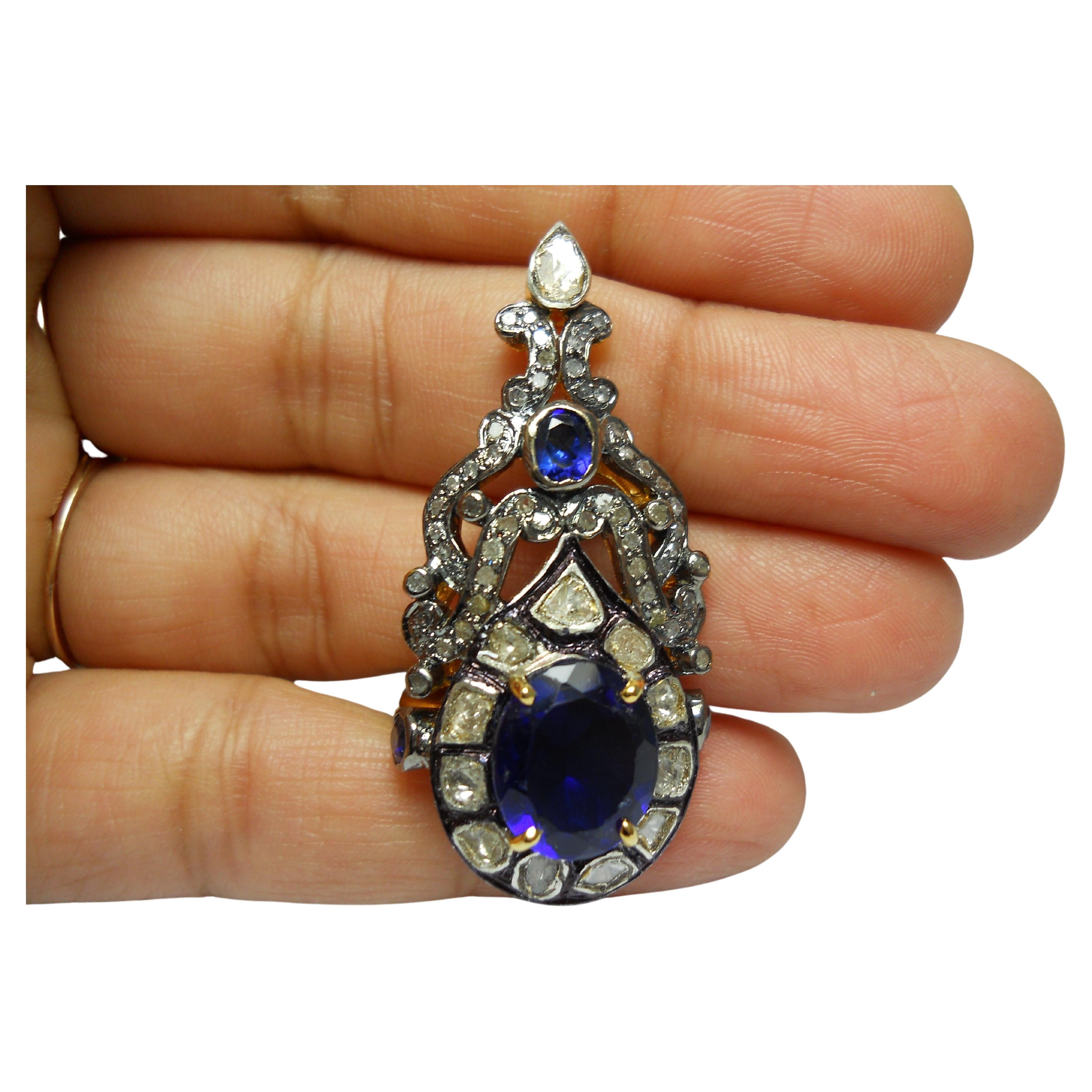 -Diamond type- Natural rose cut, natural uncut diamond

-Diamond color- white with a tint of grey

-Diamond weight- 2.35ctw

-Metal- 925 Sterling silver

Metal color- oxidized silver and yellow gold plated

Gemstone- blue sapphire (Lab
