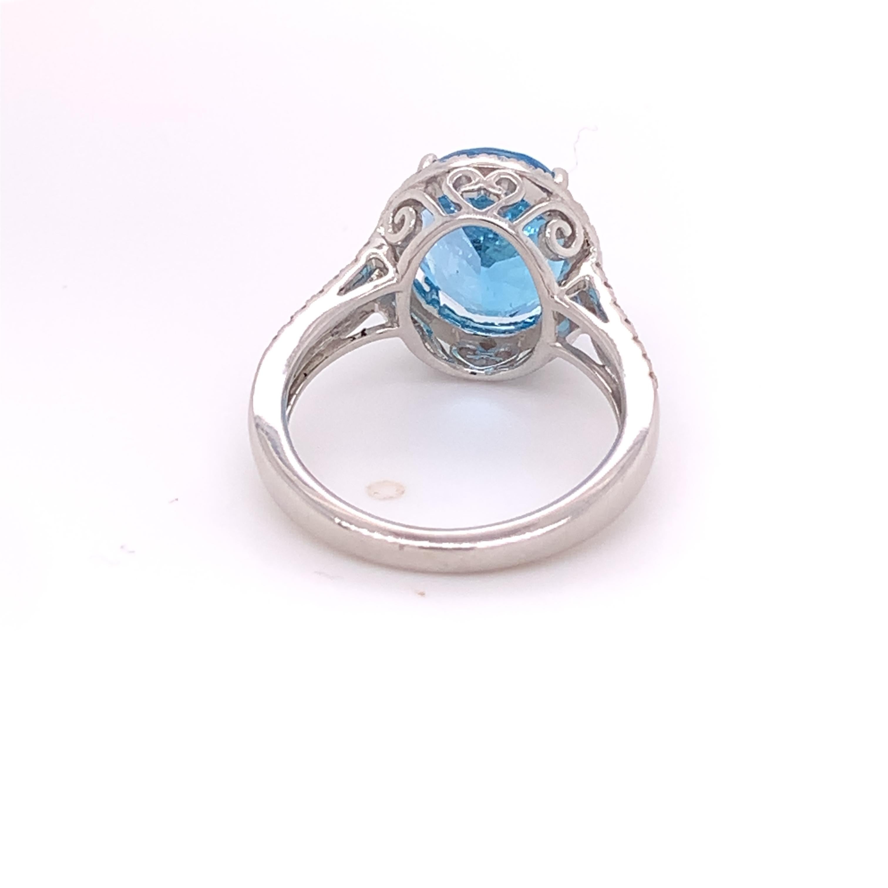 Oval Cut IGI Certified Oval Blue Topaz and Diamond 14k White Gold Halo Ring For Sale