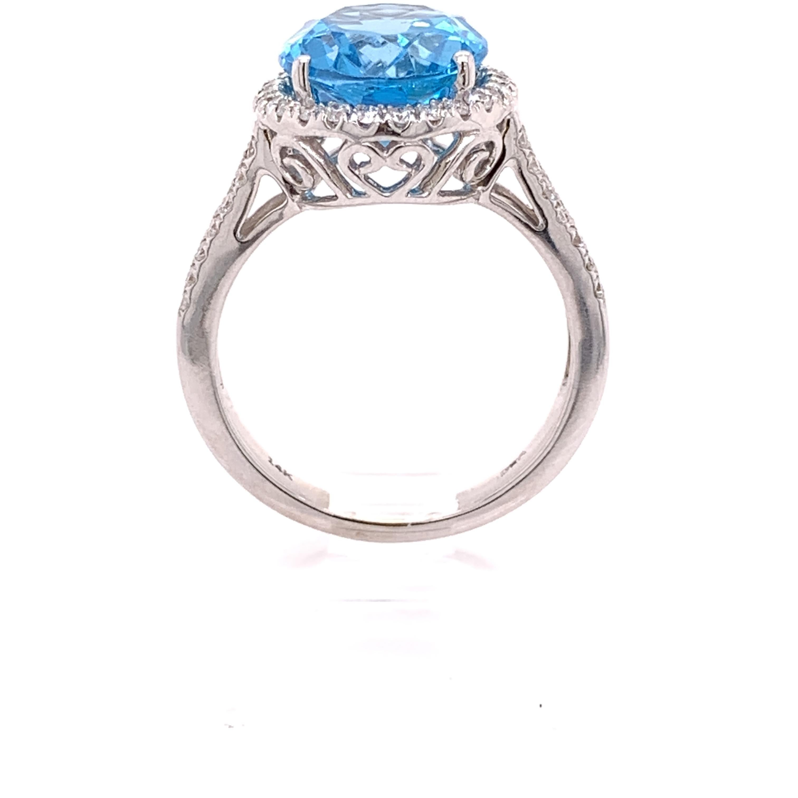 IGI Certified Oval Blue Topaz and Diamond 14k White Gold Halo Ring In New Condition For Sale In Houston, TX