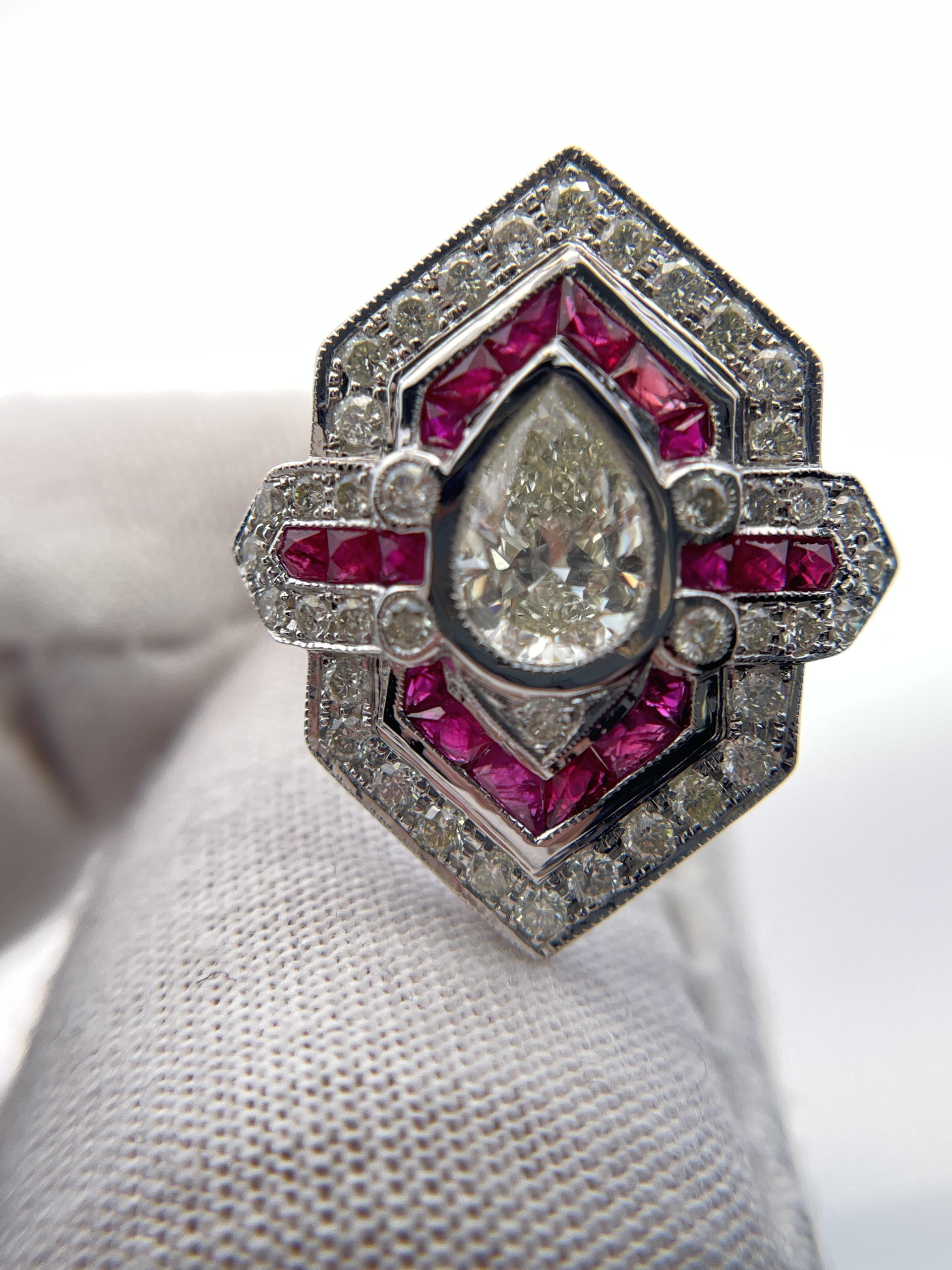 Experience the allure of this striking statement ring, a masterpiece of modern design. At its heart lies a 1.0-carat pear-cut white diamond, exhibiting a slightly included clarity(SI2) and an L color grade, exuding a subtle warmth. Surrounding the