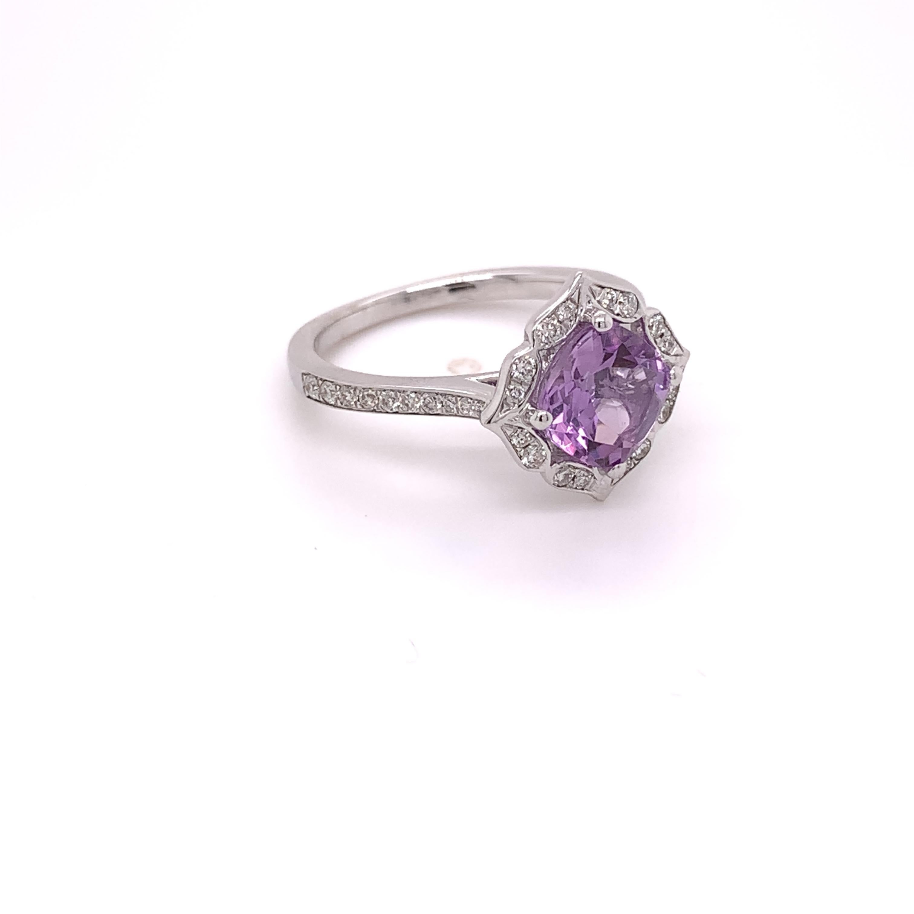This ring was crafted in 14 karat white gold. It has a natural 1.37 carat cushion cut amethyst measuring 7.00 x 7.00 x 4.50mm. This ring also contains 36 natural round brilliant diamonds weighing approximately 0.27 carats (H-I color, and I1