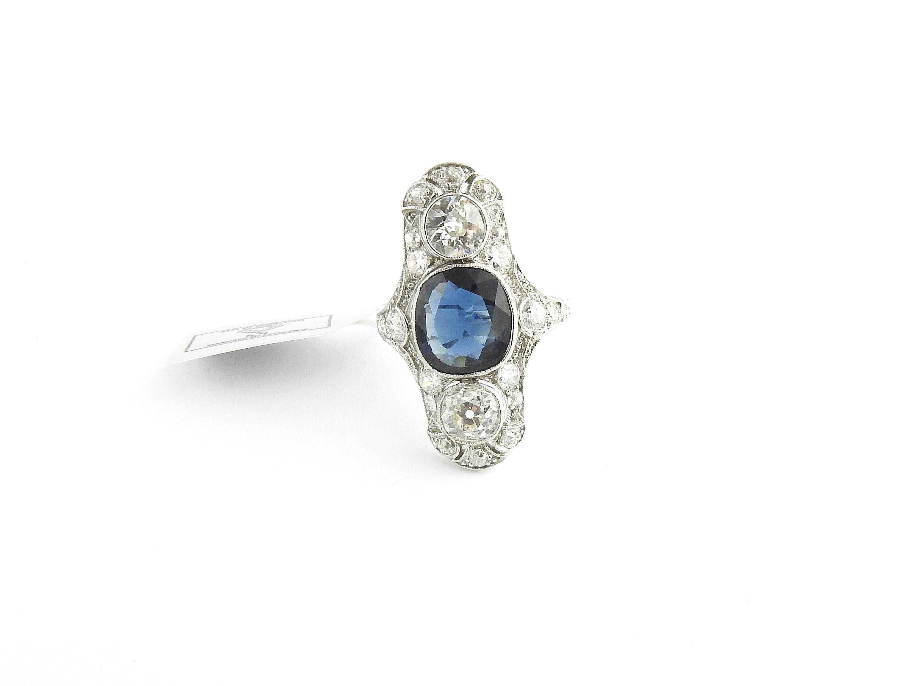 IGI Certified Vintage Platinum Natural Sapphire and Diamond Ring

Size 8

Front of the ring measures 28 mm in length, 17 mm wide and 4 mm thick.

3.9 dwt / 6.2 g

Center stone is a natural sapphire at 3.07 carats. Cushion Mixed Cut. Evidence of heat