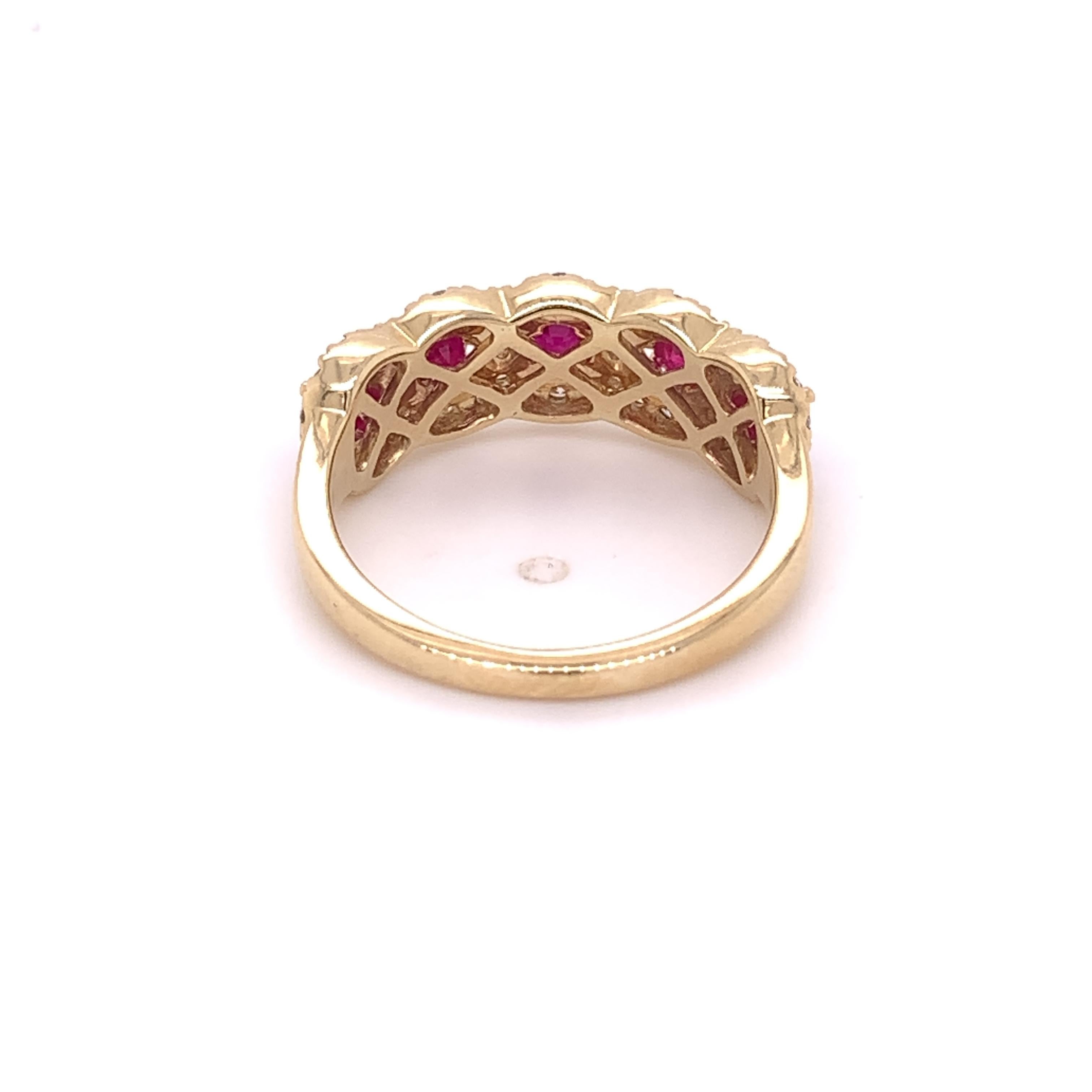 A stunning cocktail ring crafted in 14 karat yellow gold with 5 round natural ruby stones, 0.135 carats each totaling approximately 0.67 carats. The measurements for these stones are 2.90 - 2.90 x 1.74mm. This ring also contains 48 natural round