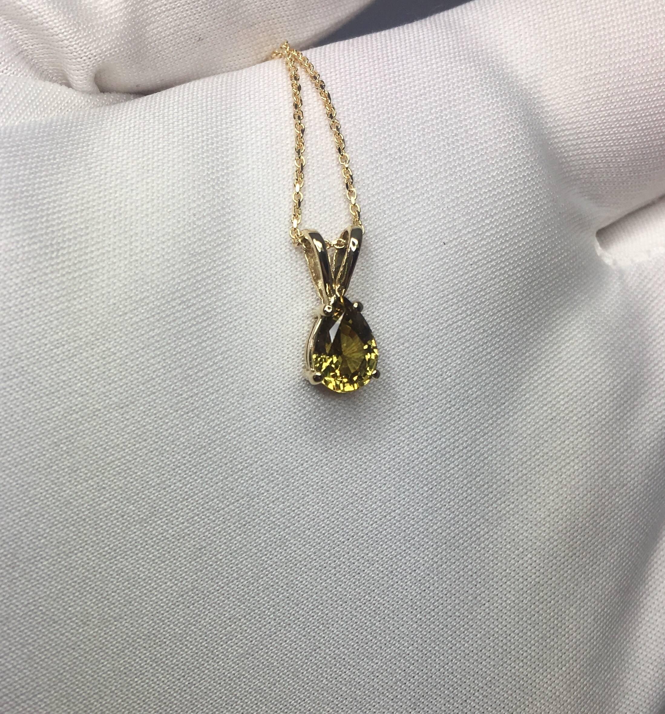 Natural bright brownish yellow sapphire solitaire gold pendant. 
Beautiful pear cut Sapphire with a very unique brownish yellow 'cognac' colour, very unique.

Totally untreated and unheated. Very rare for Sapphires. 
1.00 carat stone with a