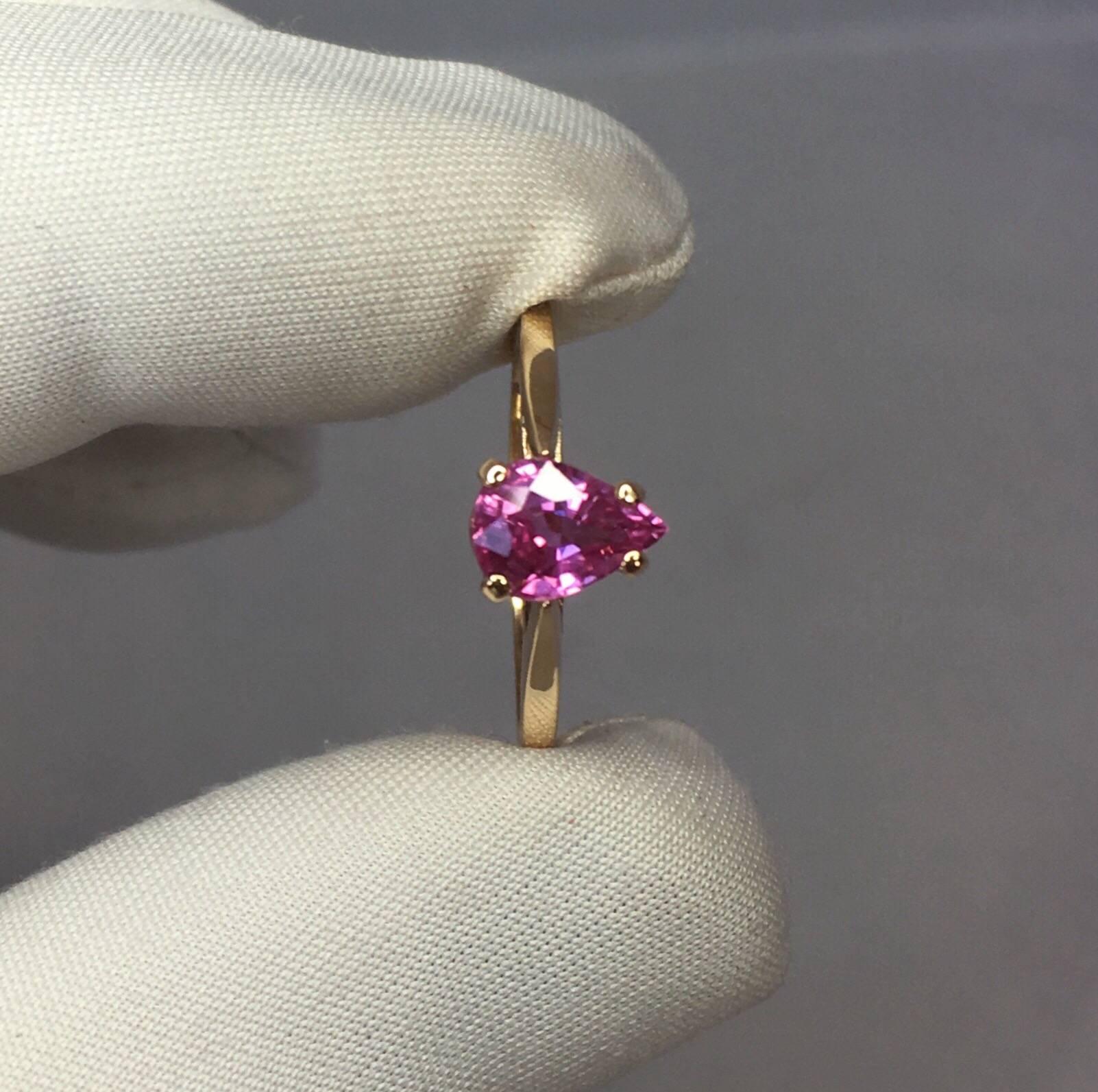 Stunning vivid purplish pink sapphire set in a fine 14k yellow gold solitaire ring.

Totally untreated and unheated, comes with full IGI report to confirm stone as natural and untreated. 

1.05 carat sapphire with stunning colour, very bright and