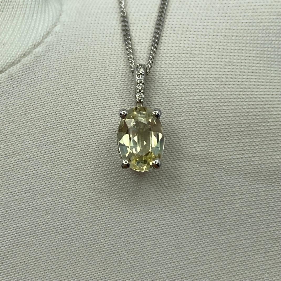 IGI Certified Untreated Ceylon Yellow Sapphire & Diamond 18k White Gold Pendant Necklace.

0.90 Carat Ceylon sapphire with fine vivid pinkish yellow colour and excellent clarity, practically flawless. Also has an excellent oval cut which displays