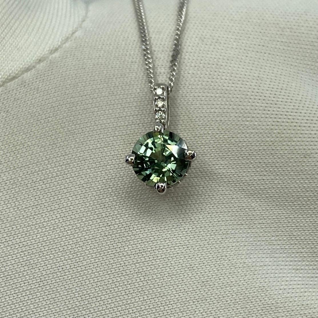 IGI Certified Untreated Green-Blue Sapphire & Diamond Surround Set 18k White Gold Diamond Pendant.

1.12 Carat sapphire with fine vivid green blue colour and excellent clarity, practically flawless. Also has an excellent round cut which displays the