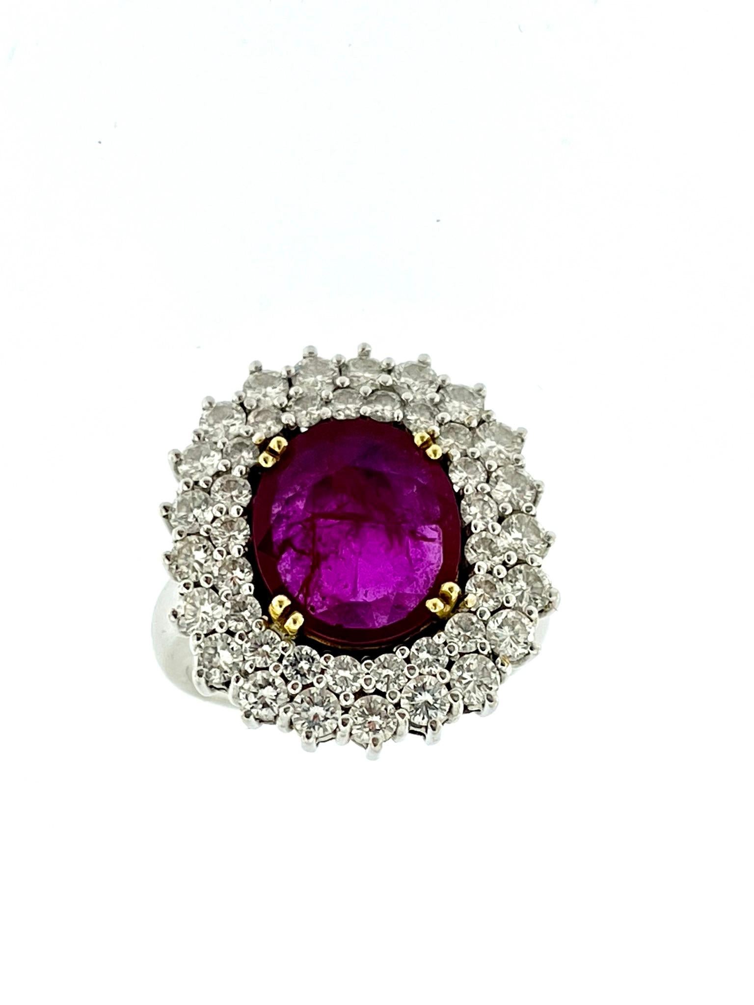 The IGI Certified White Gold Diamonds and 3.40ct Ruby Cocktail Ring is a dazzling statement piece that exudes sophistication and luxury. 

Crafted from 18kt white gold, this cocktail ring boasts a sleek and modern design that perfectly complements