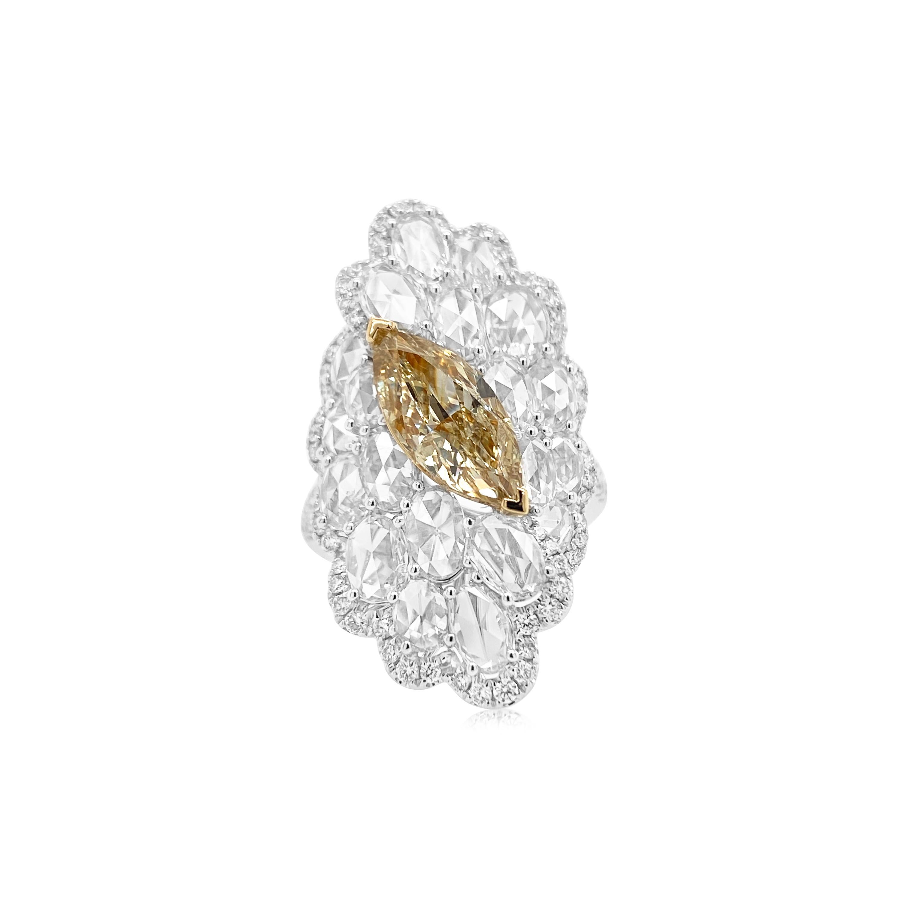 This ring has an opulent look with a Rare Yellow diamond at the centre , ordained by 20 oval Rose-cut diamonds encircled by more than 100 round brilliant cut white diamonds. A rare beauty with an exceptional fire and lustre.


-1 Rare Marquise