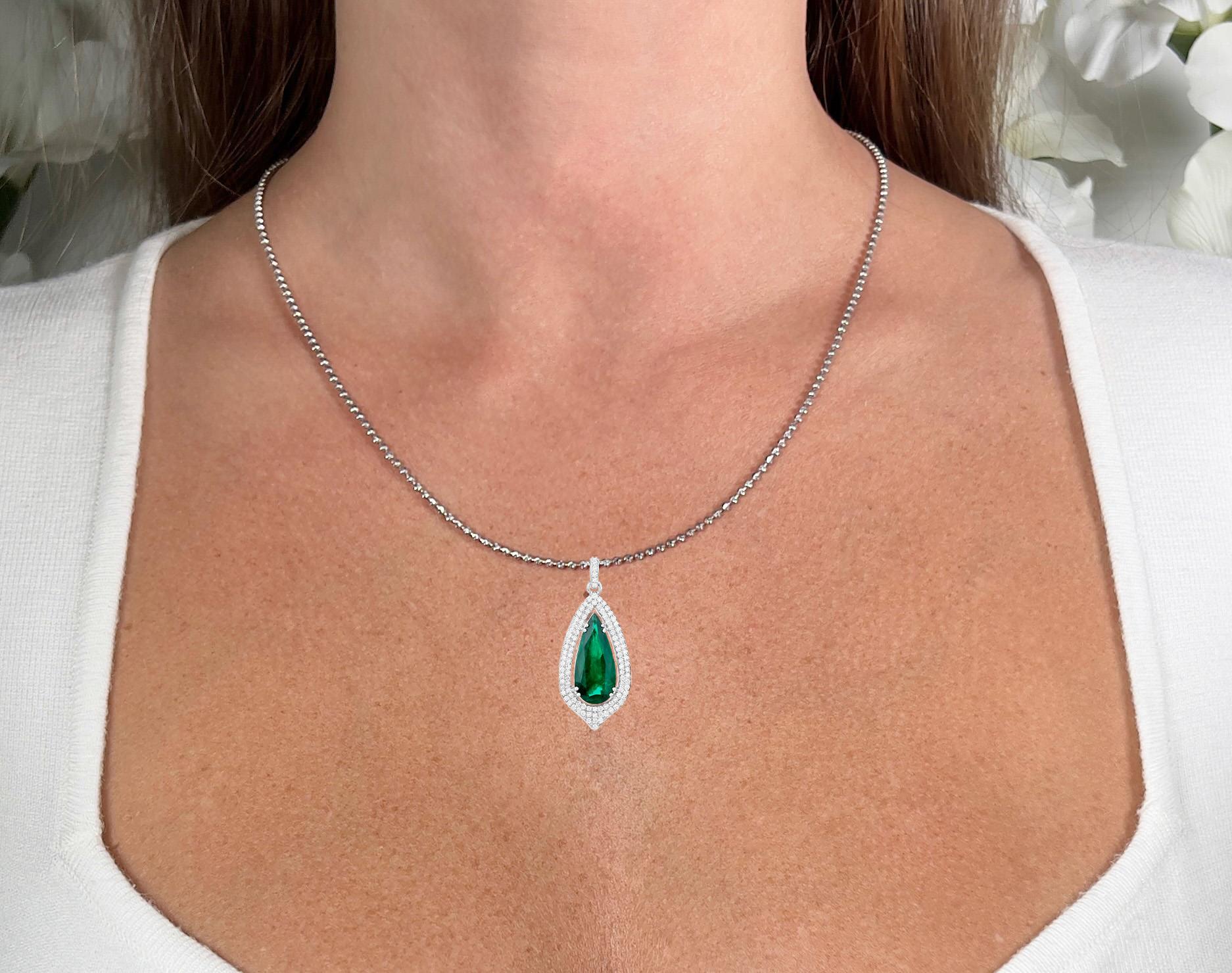 It comes with the IGI Certificate
All Gemstones are Natural
Pear Zambian Emerald = 4.69 Carat
104 Round Diamonds = 0.68 Carats
Metal: 14K White Gold
Pendant Dimensions: 35 x 15 mm

