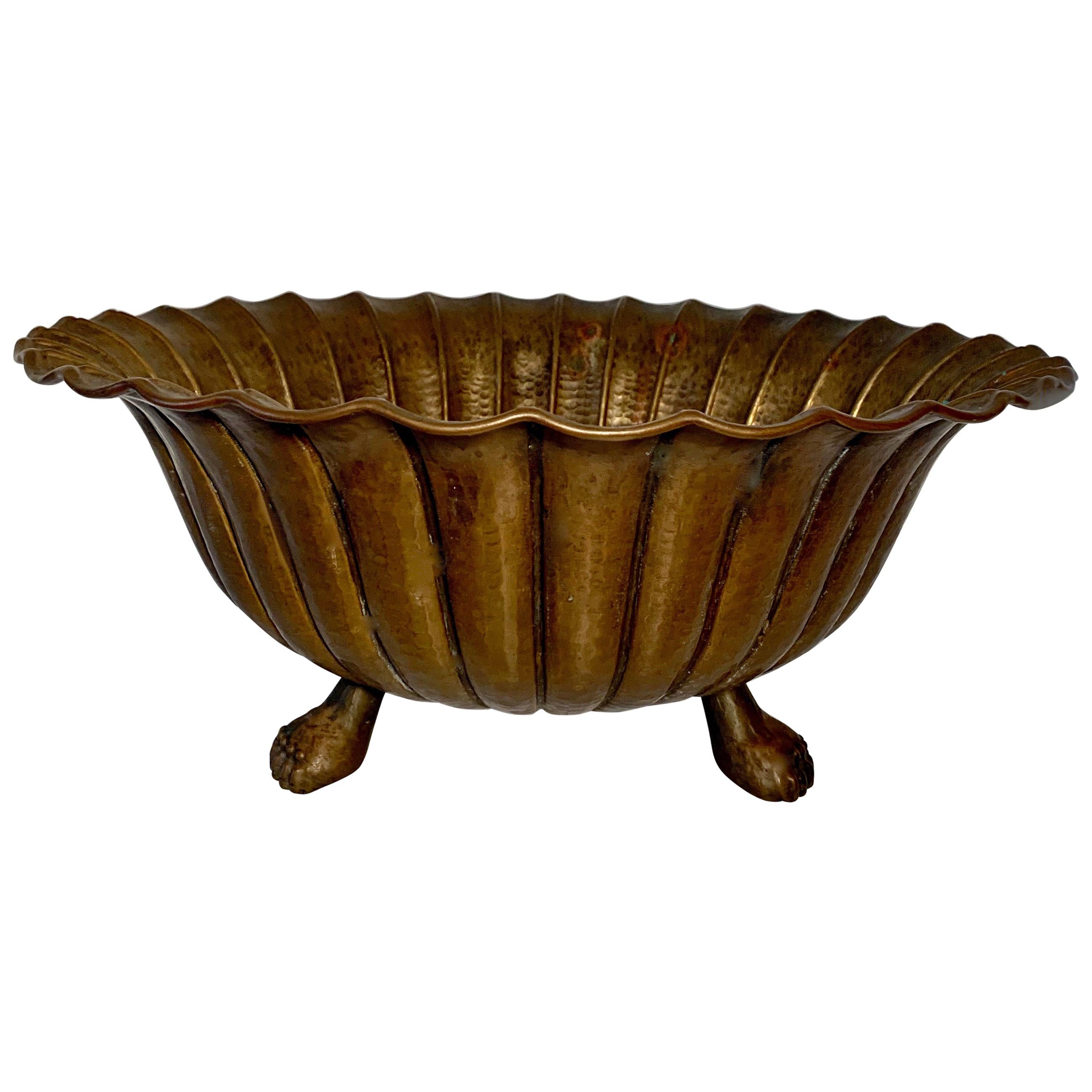A monumental Egidio Casagrande Italian hammered footed bowl in brass. A rare and handsome bowl patinated to perfection.  A compliment to any shelf or wonderful fruit, serving or center bowl. 

Also great for mail, a catch all or decorative