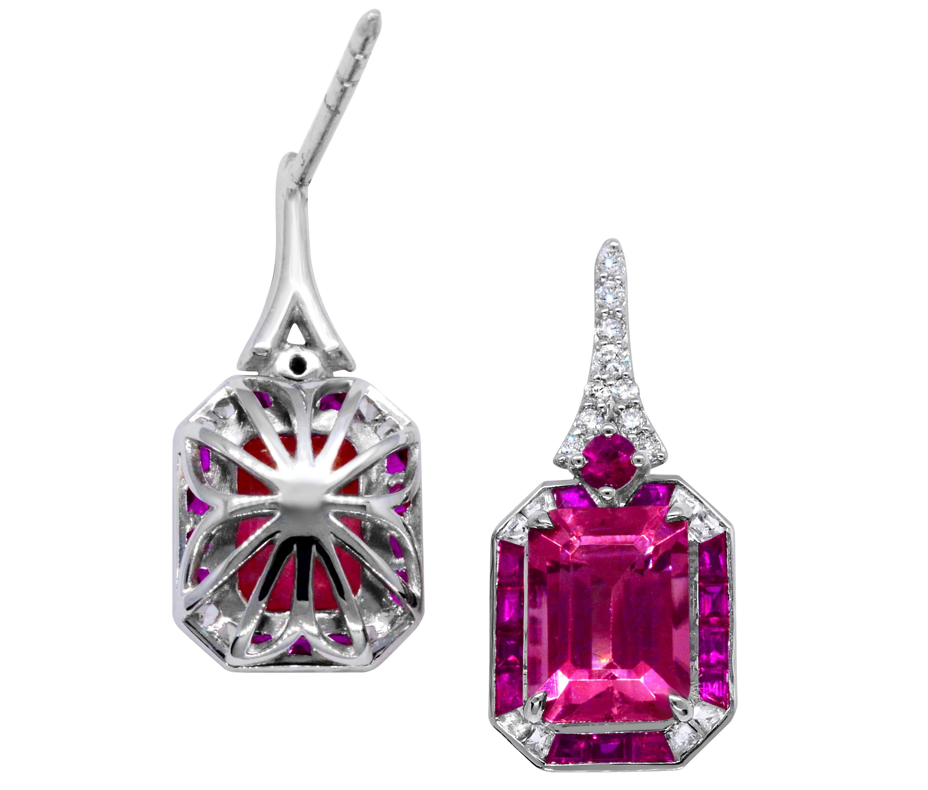 Emerald Cut Pink Tourmaline with Ruby, White Sapphire and Diamond Cocktail earrings.  These emerald-cut pink tourmaline earrings are framed by baguette rubies, white sapphire and diamonds.  There is a total gemstone weight of over 7.0 carats in