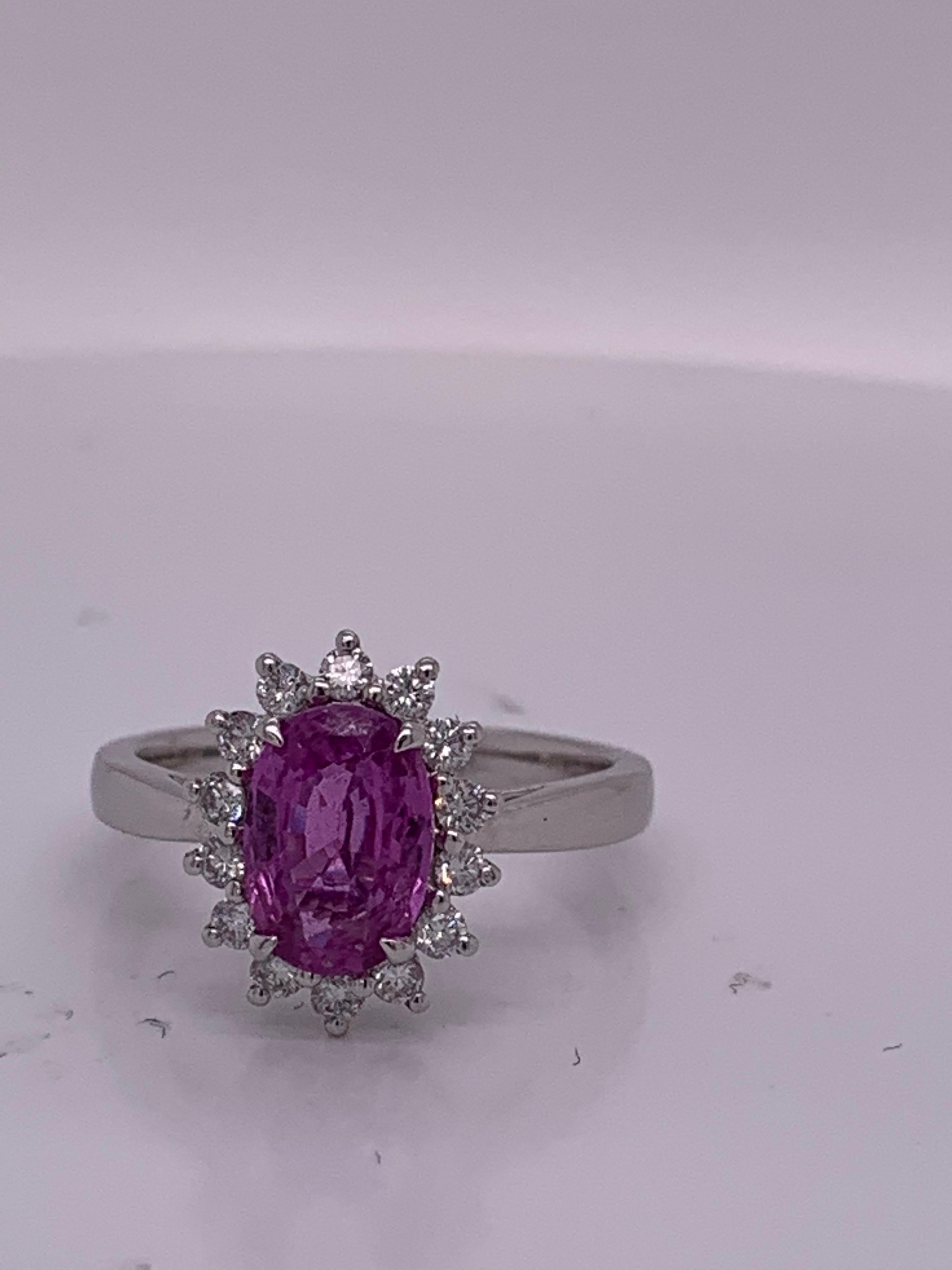 Natural 1.85  Carat Oval Pink sapphire and 0.35 carat Diamond set in Platinum is one of a kind handcrafted Ring. Pink Sapphire is not heated . The Ring is sizable 7

