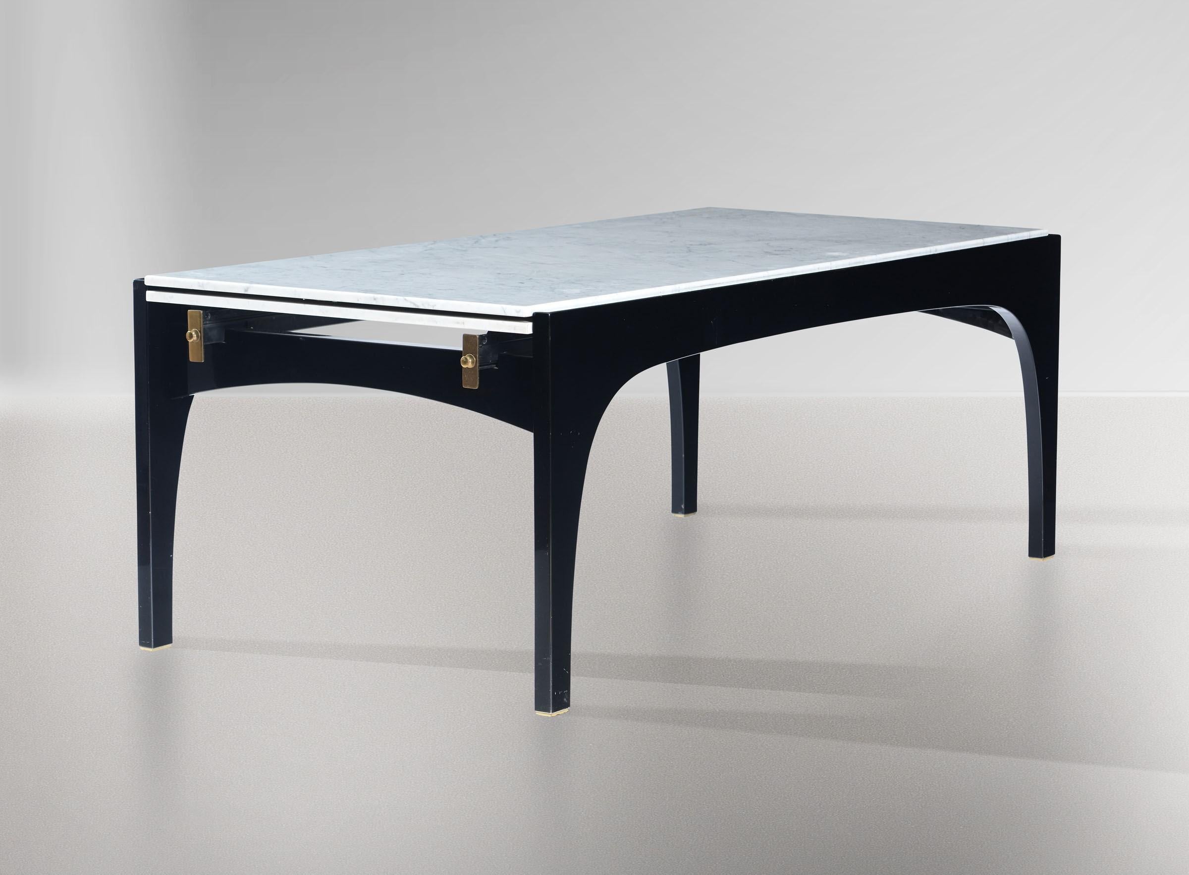 An exceptional and rare extendable dining table designed by Ignazio Gardella for Misura Emme, Italy, circa 1985. This impressive rectangular table is black lacquered with brass detailing and has an amazing engineered system for extending the Carrara