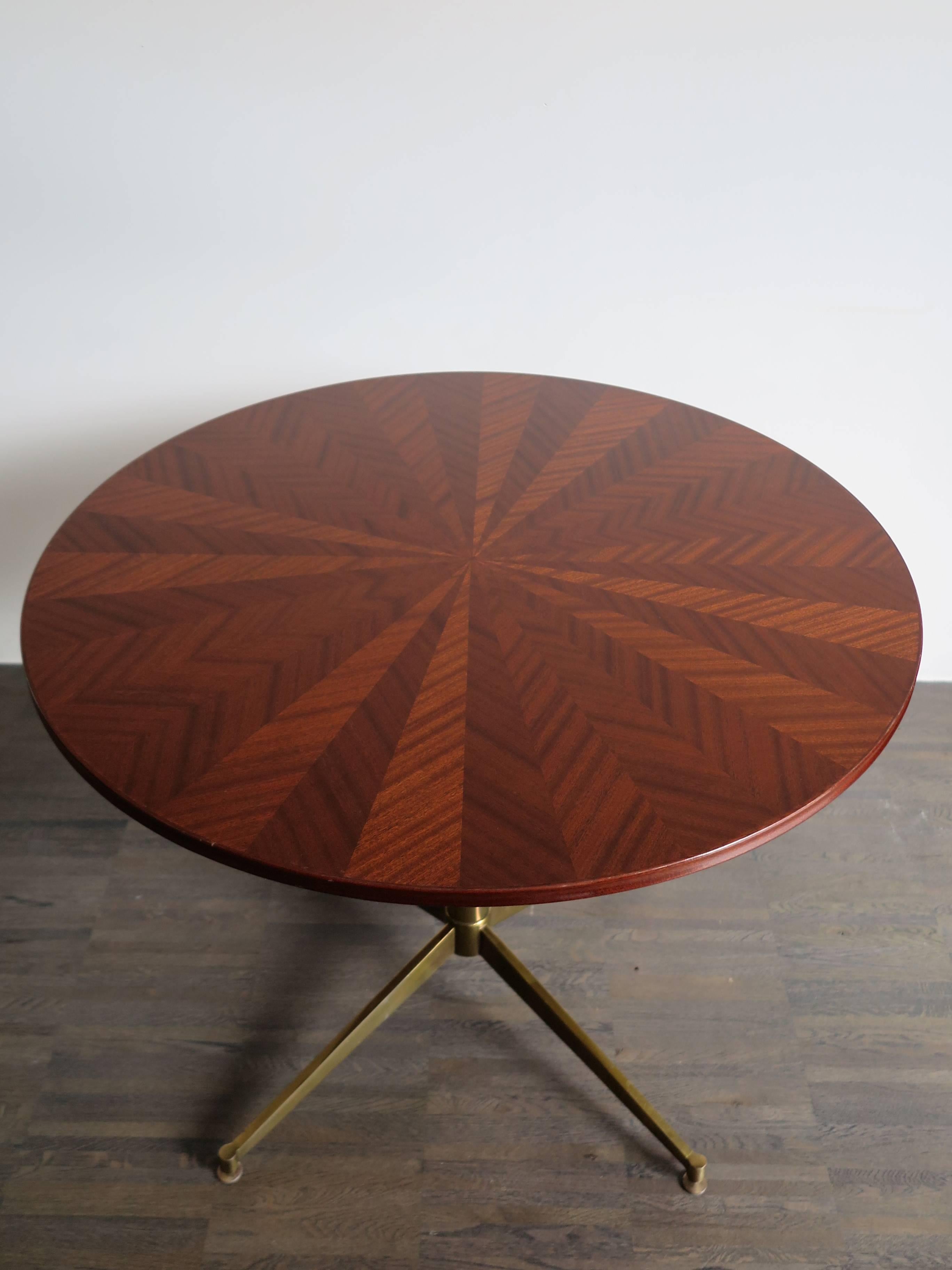 Very famous, rare and amazing Italian Ignazio Gardella table or coffee and cocktail table produced by Azucena with top in dark veneered wood inlay and glossy varnish, amazing brass structure with variable height (from minimum of 55 cm up to a