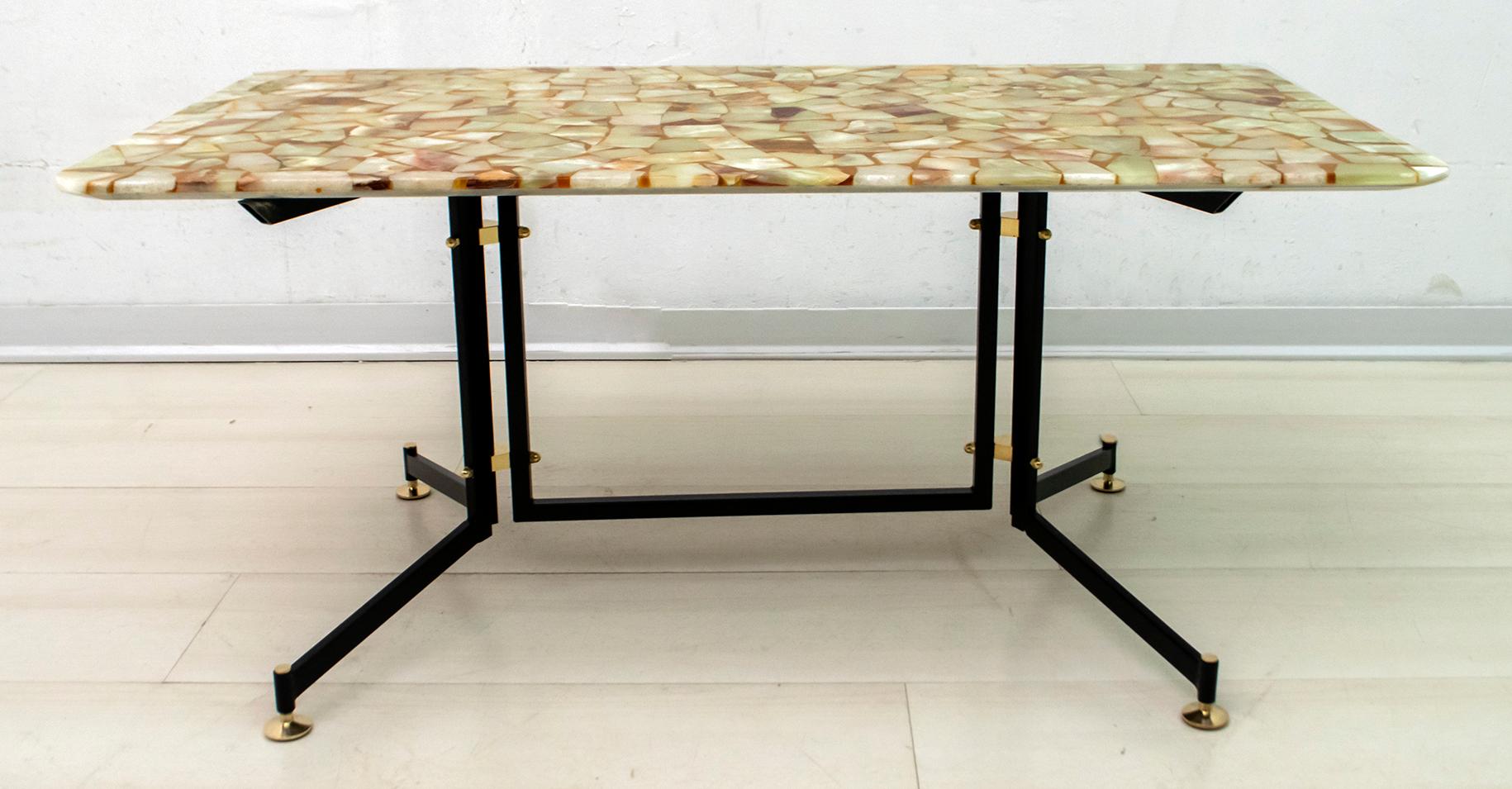 Coffee table designed by the famous architect Ignazio Gardella for Azucena. The top is in mosaic with alabaster and resin dowels, the base is in painted iron, the feet are adjustable in height and some finishes are in brass.