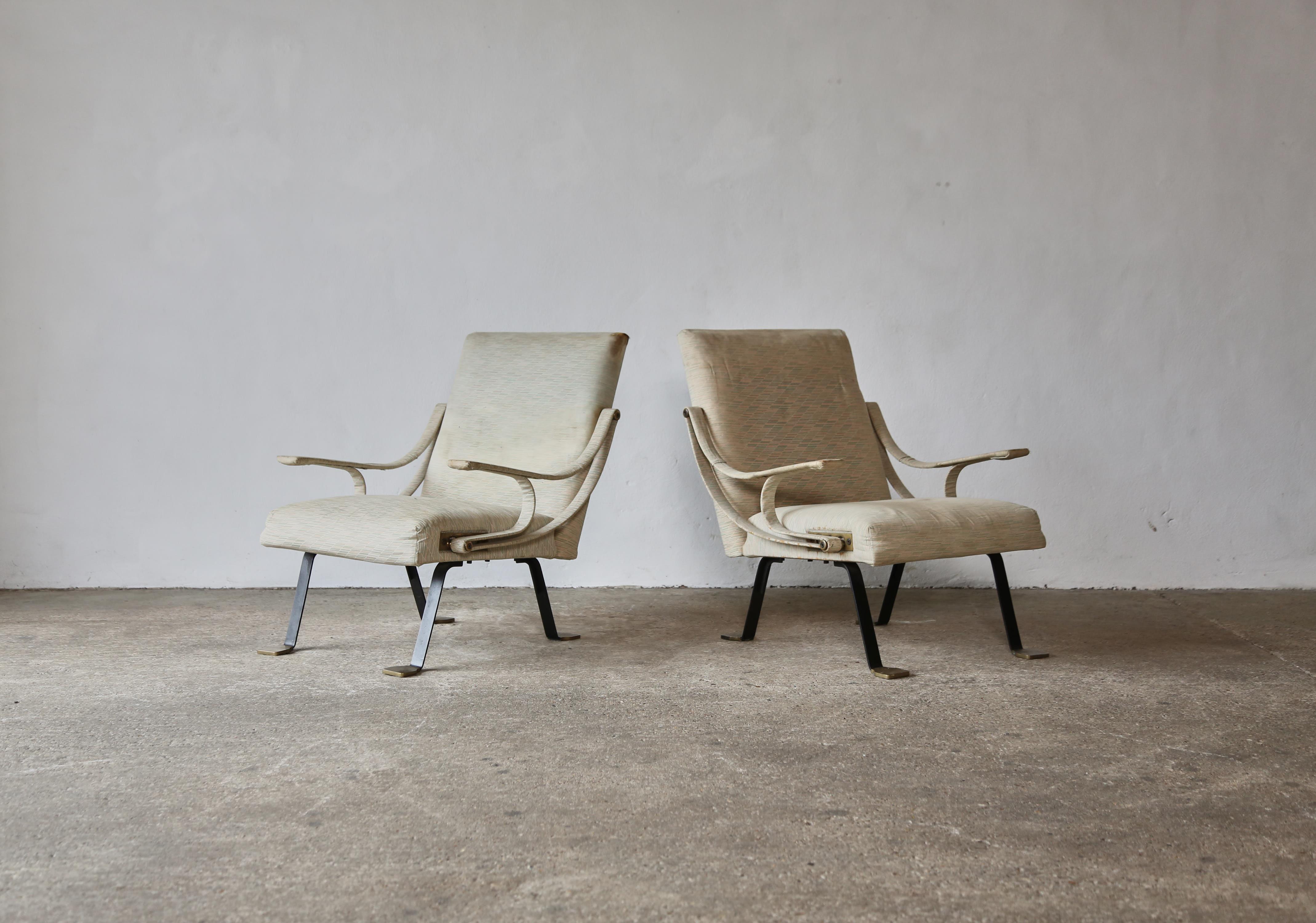 An original, early pair of Ignazio Gardella Reclining Digamma chairs, designed in the late 1950s and produced by Gavina, Italy in the 1960s. In original condition this pair is sold as are for reupholstery.  The metal frames are in good original