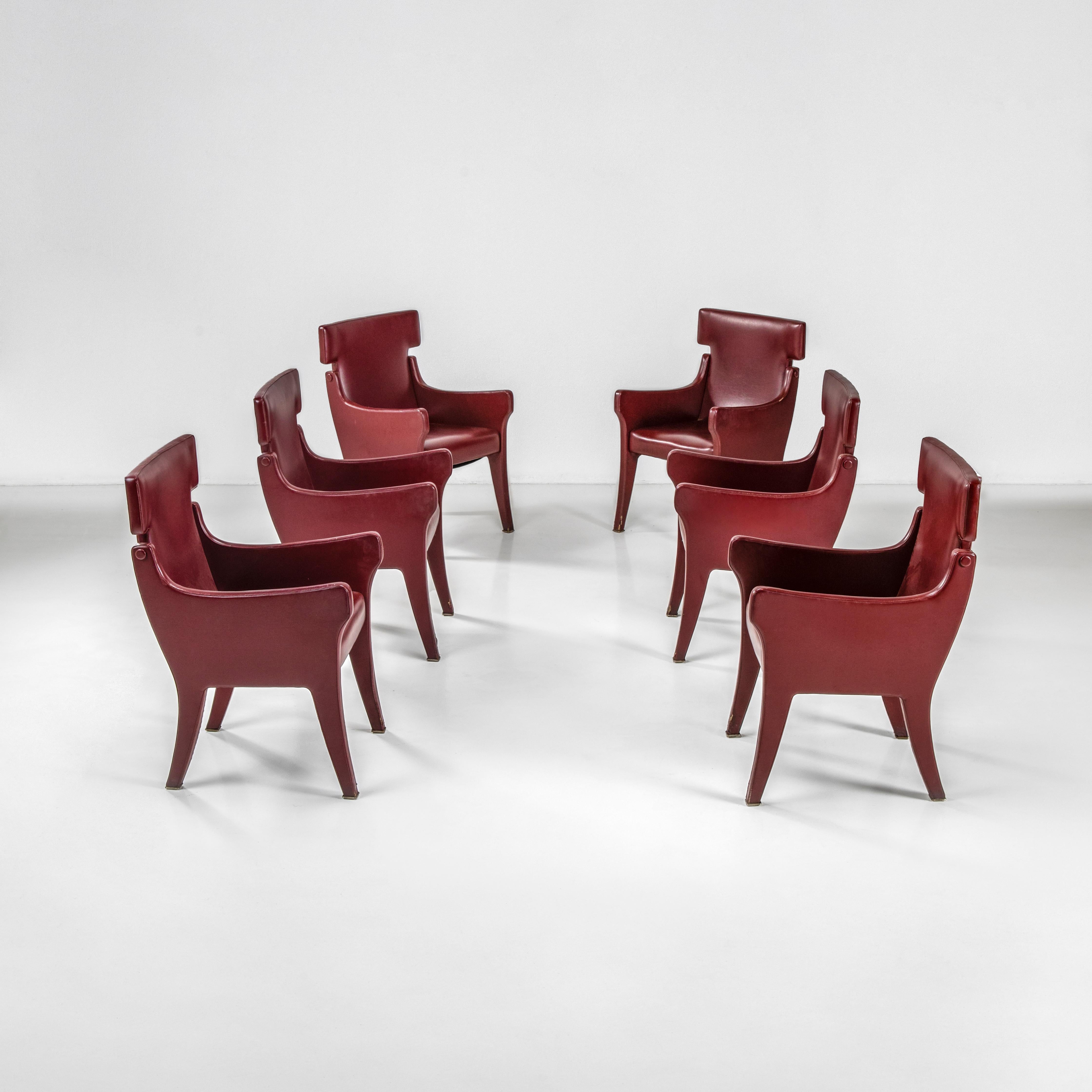 These six rare model P10 upholstered armchairs are an elegant and decorative creation by Ignazio Gardella, one of the masters of 20th-century Italian design. The six armchairs are upholstered in skai, a synthetic vinyl leather much in use in those