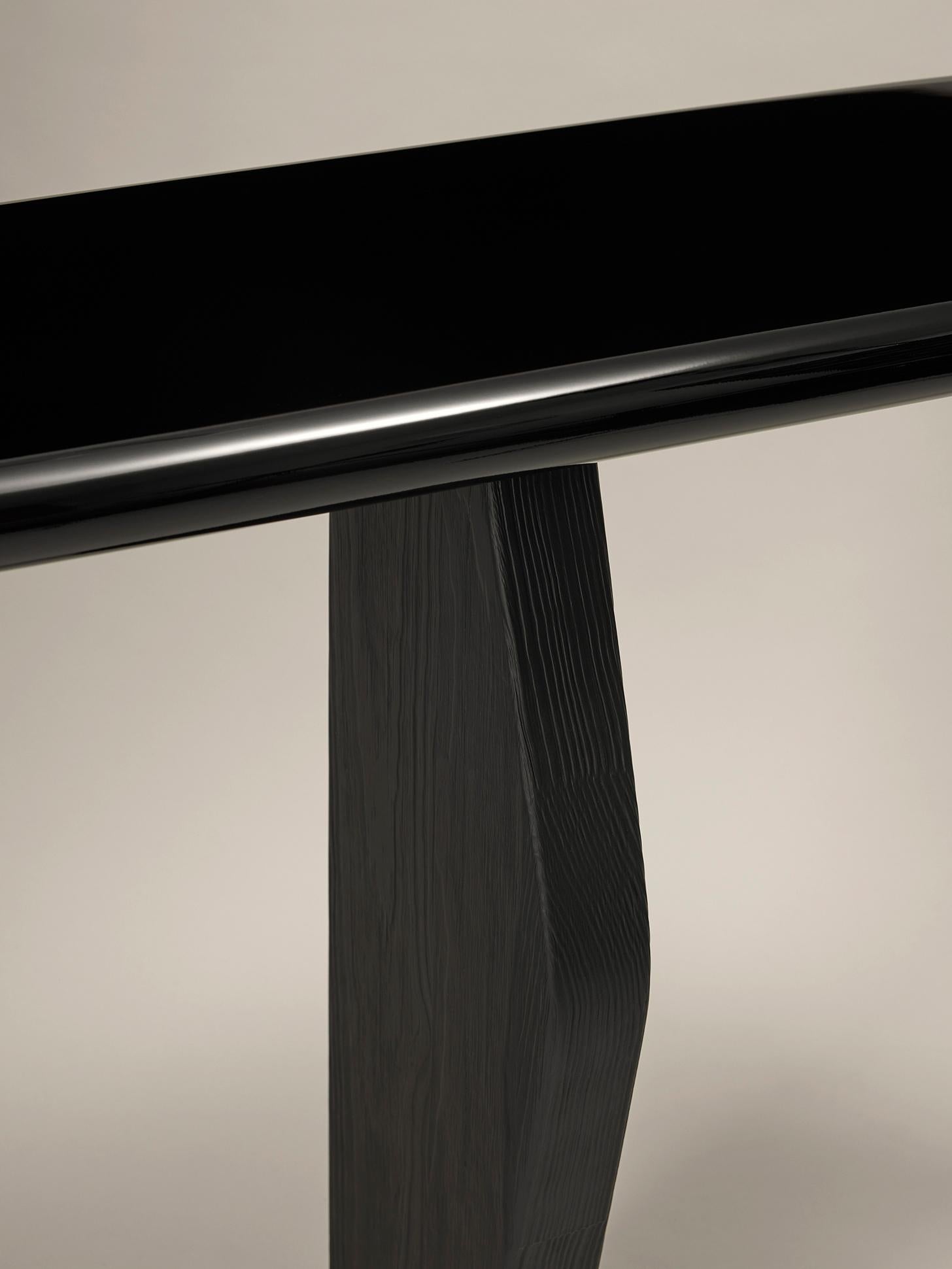 Ignis Console
Tray in a shiny black lacquer (RAL 9005)
Feet in brushed pine wood tainted in black

Dimension (cm) : L 110 x P 32 x H 83

Evoking both nothingness and infinity in the collective unconscious, the color black is laden with mystery and a