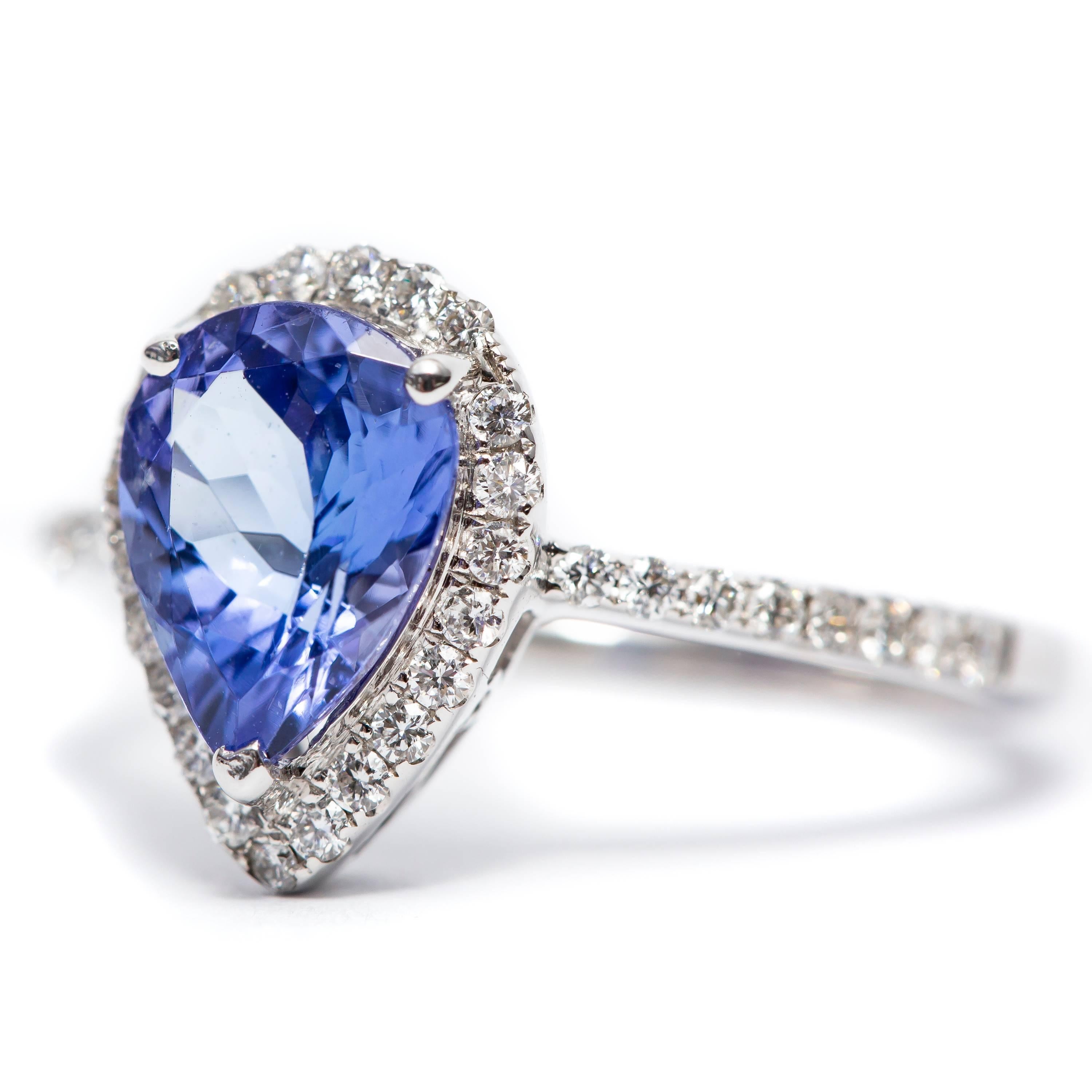 A beautiful 1.58 Carat pear shaped tanzanite engagement ring featuring 0.41 Carat of white Color G Clarity VS1 Round Brilliant Diamonds. Set in 18 Karat White Gold. 
UK size - O, USA size - 7 1/2 available in other carat sizes as well as ring sizes.