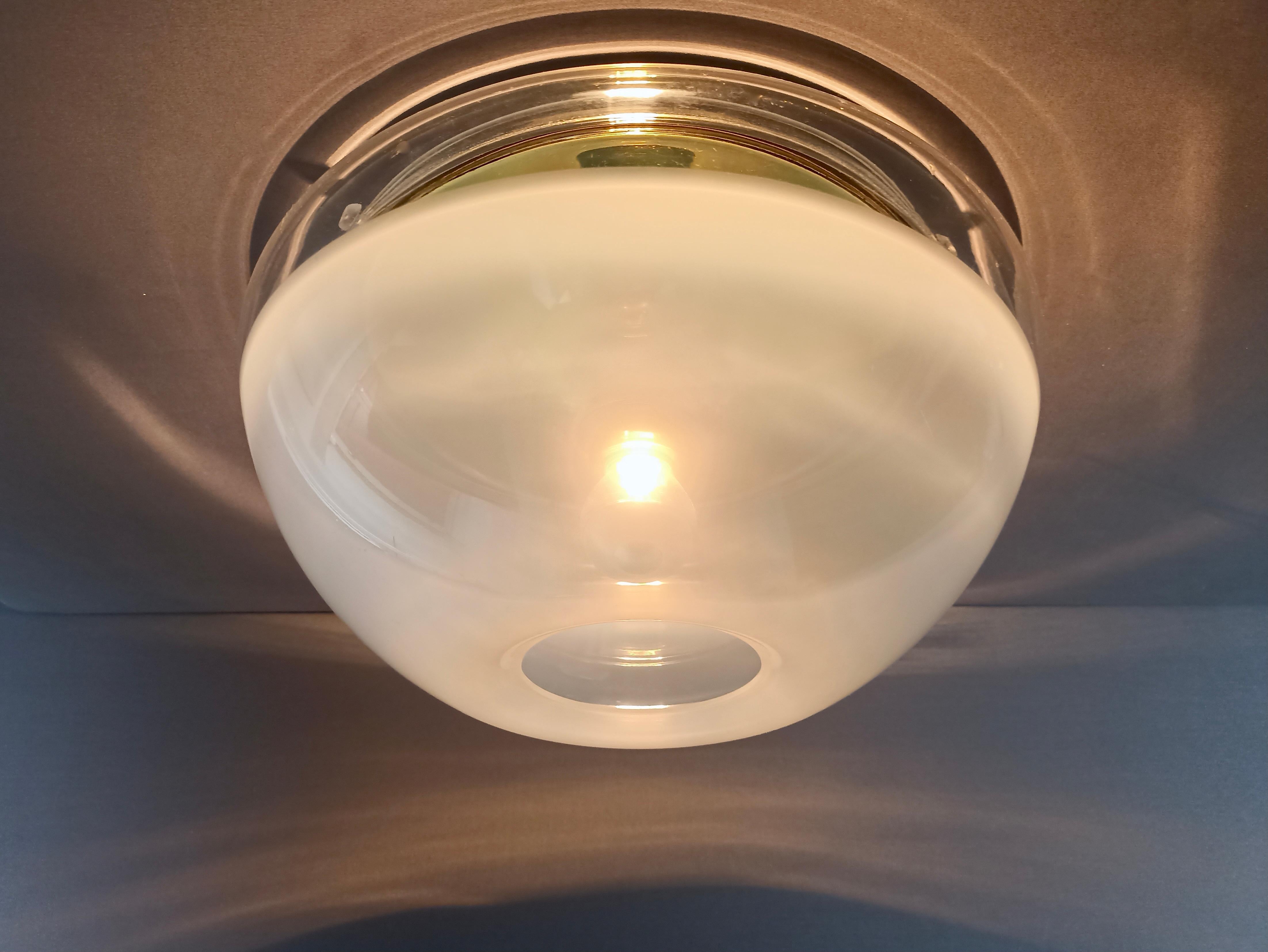 Italian iGuzzini 1970s rare and original plastic and brass ceiling lamp. For Sale