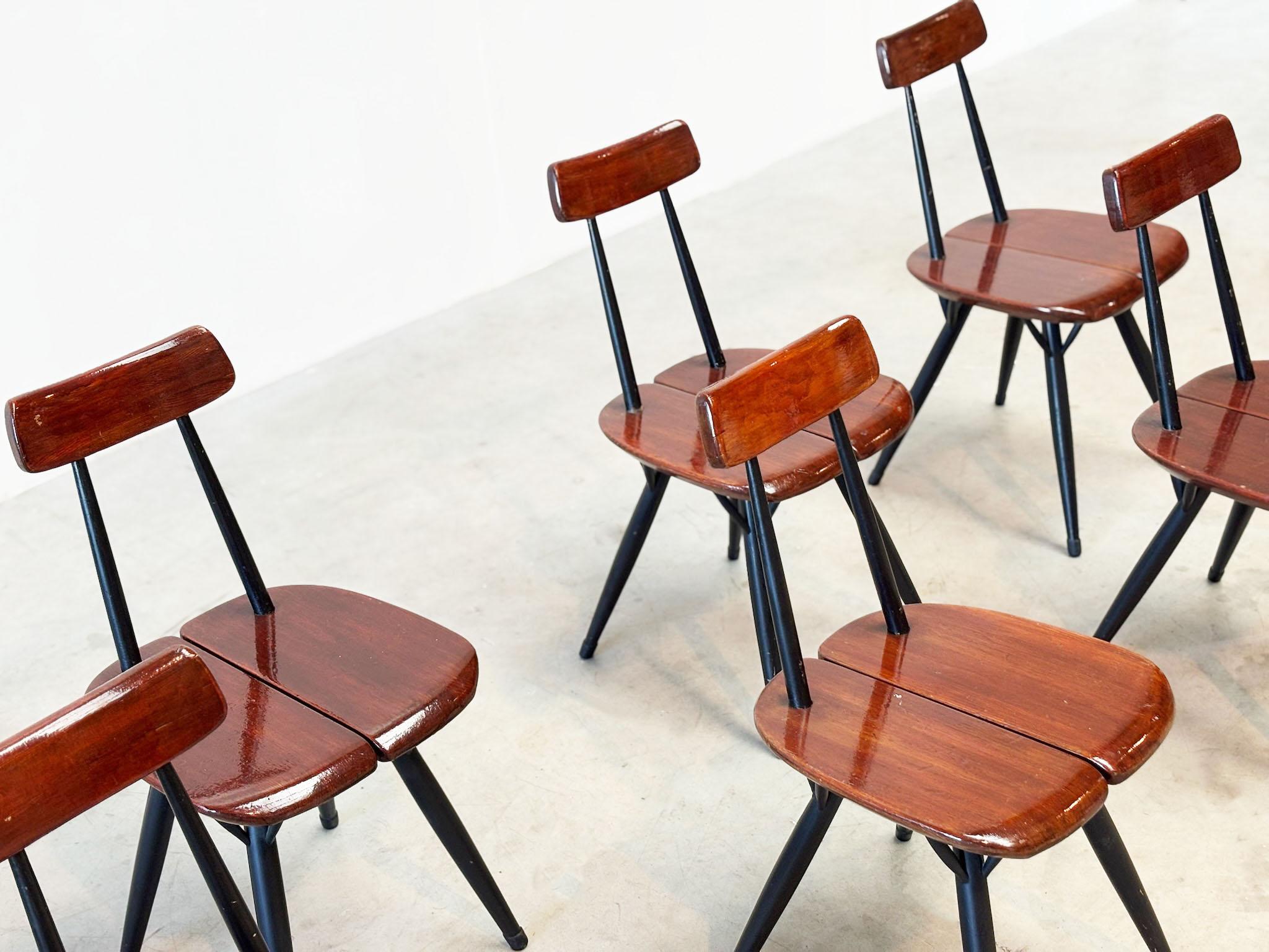 These chairs were made in Finland in the 50's. It was designed by wellknown designer Ilmari Tapiovaara. He designed these chairs for for Laukaan Puu Finland. These chairs are a early production with still the orignal finish. Finding chairs with