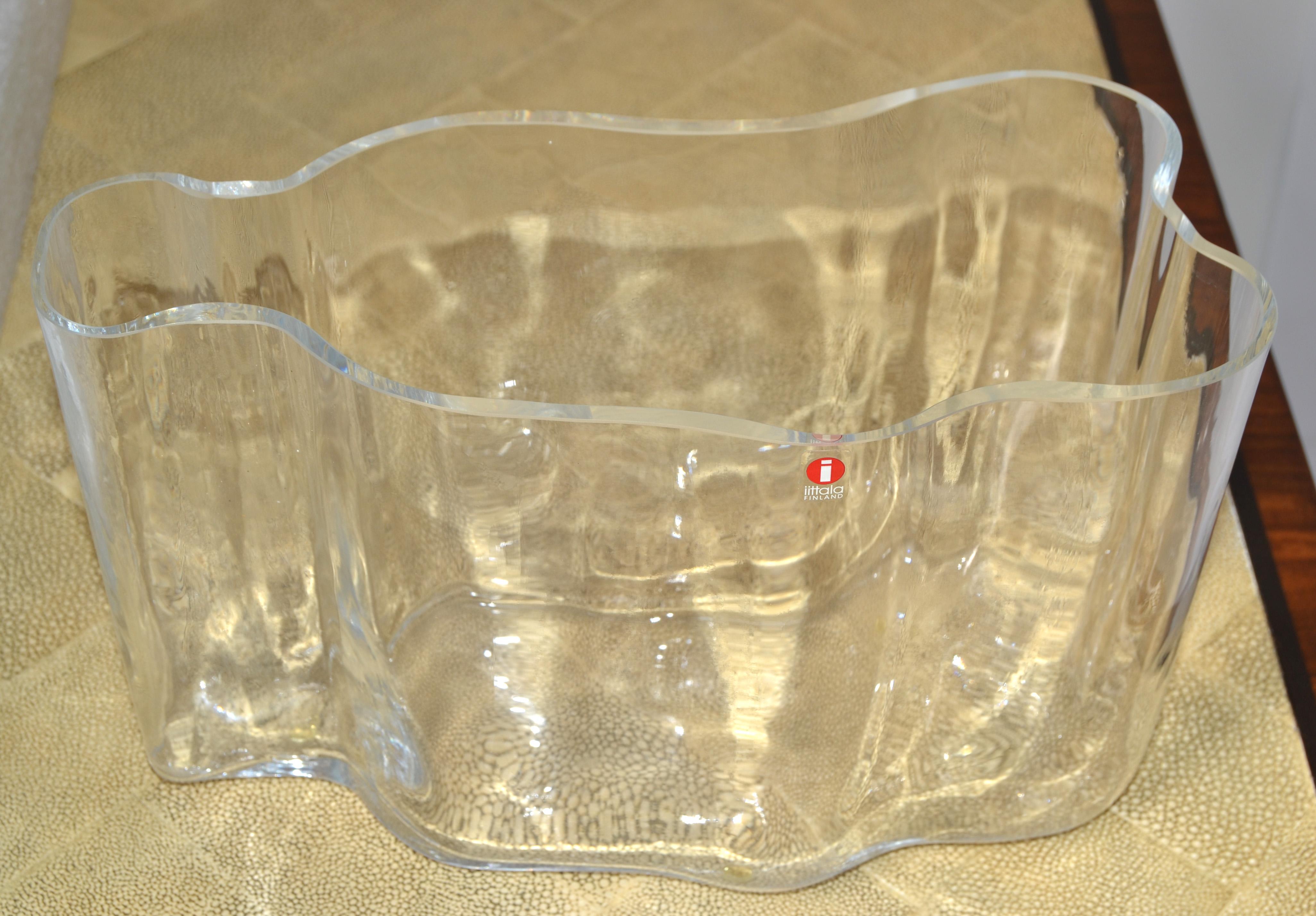 Scandinavian Modern sculptural transparent art glass savoy vase designed by Alvar Aalto for Iittala, made in Finland. 
This is a beautiful handmade iconic piece from the 1980s.
Foil label is attached to the vase, Iittala Finland.
  