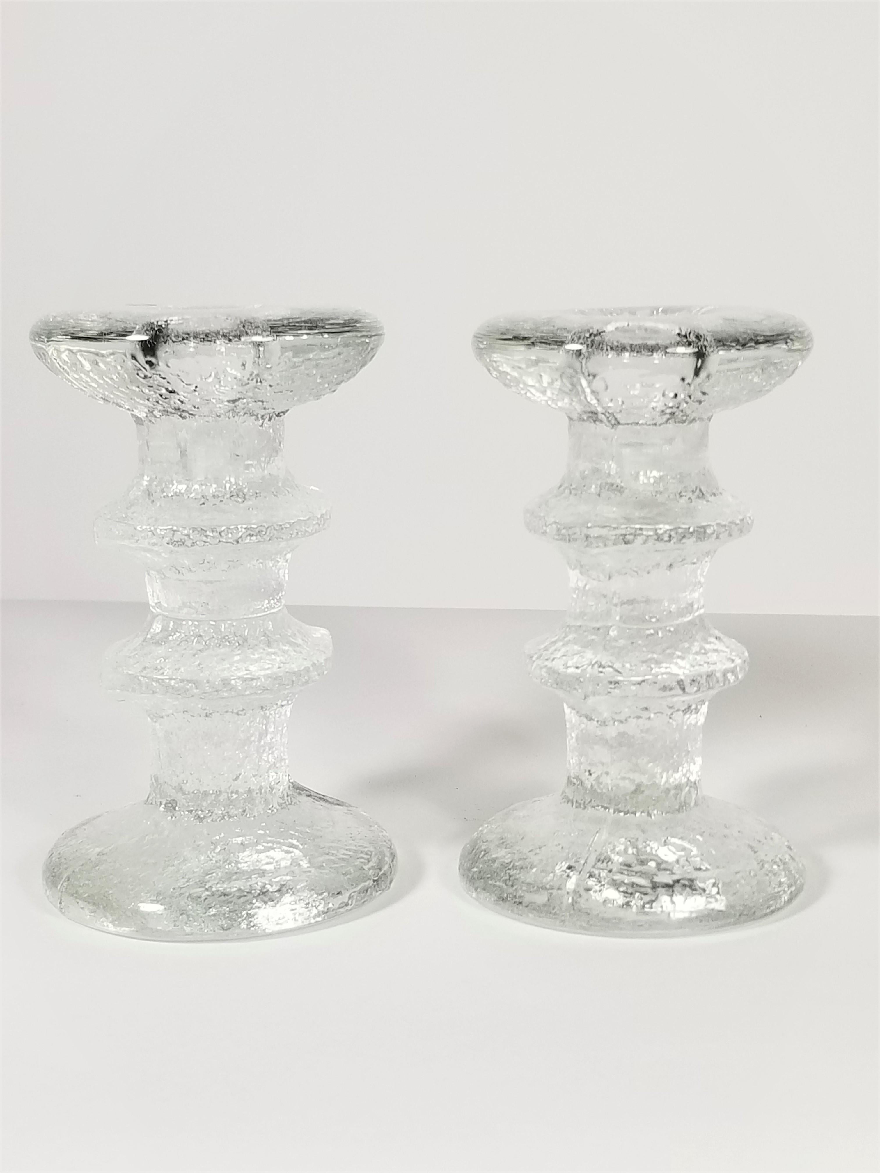 Pair of mid century Iittala glass candlesticks. Still retains original marking stickers. Made in Finland. Excellent condition. 
Priced per pair / We currently have 2 pairs available for a total of 4
Measurements:
Height 4.75 inches
Diameter top