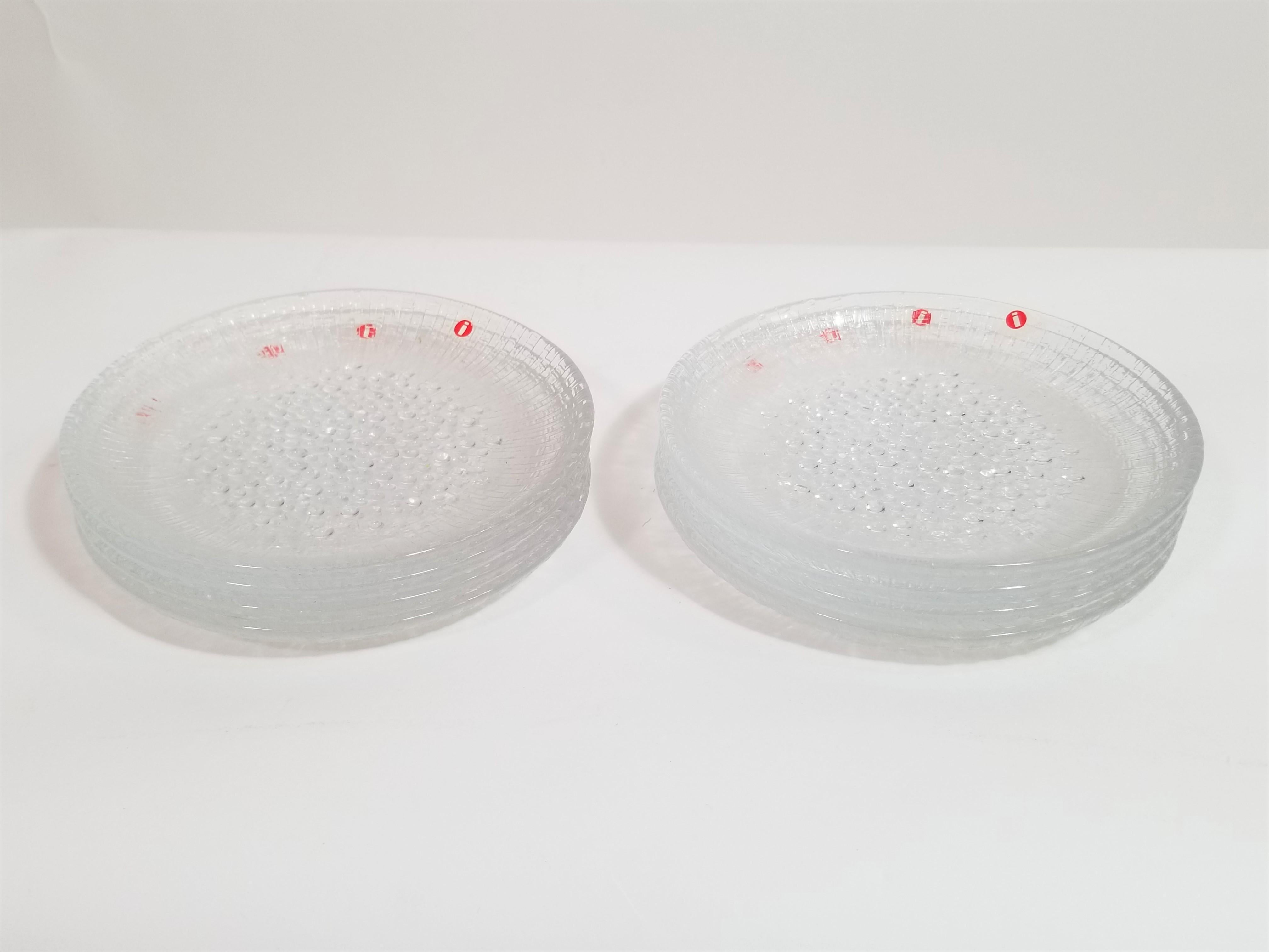 Iittala, Finland. Set of eight art glass side plates. Mulitipupose. Perfect to use for salad, cocktail dessert, bread or hot plates. Unused and still in original packaging boxes. Each Plate still retains original iittala marking sticker.