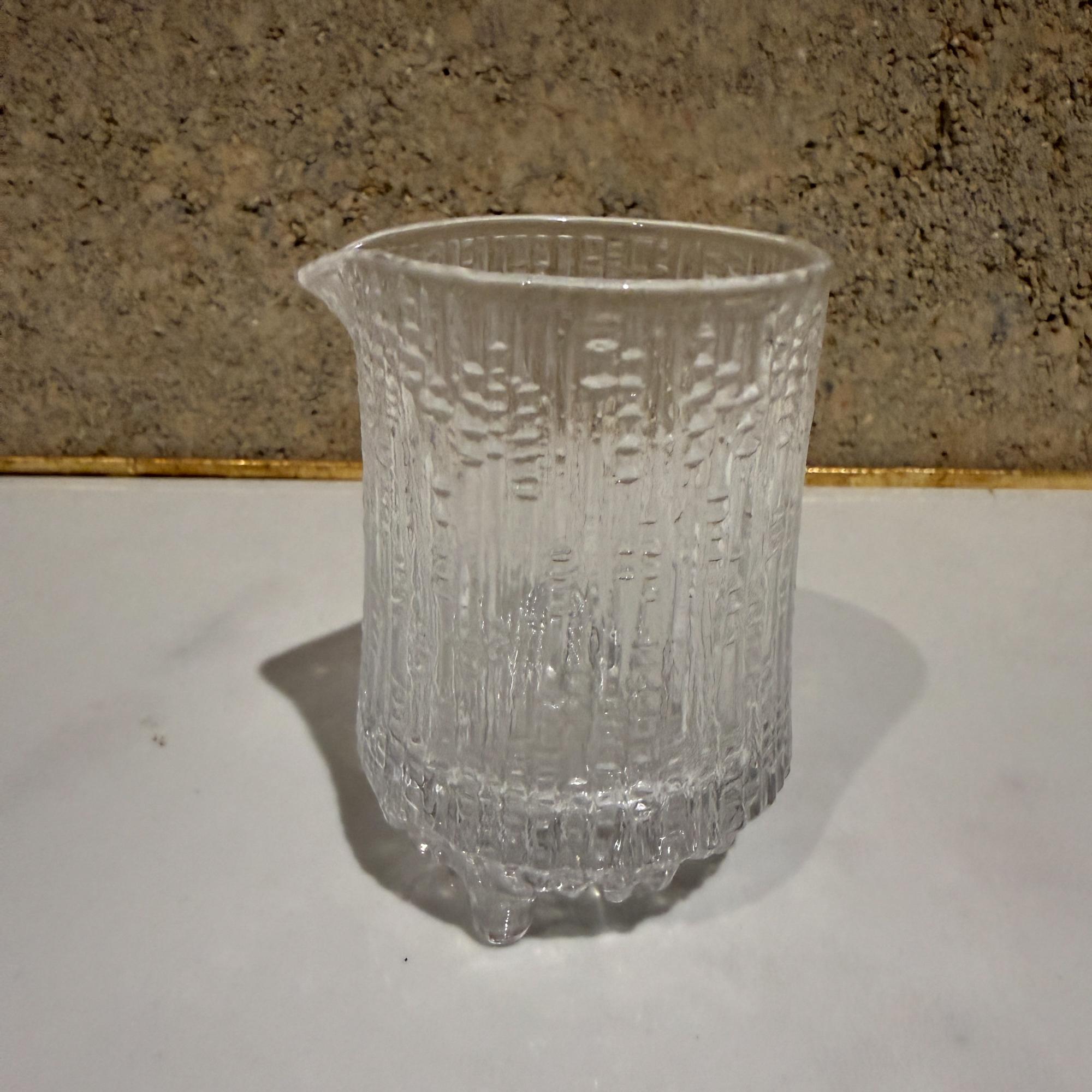 For your consideration, a  creamer from the Ultima Thule glassware collection designed by Tapio Wirkkala for Iittala. Made in Finland. Scandinavian modern, mid-century modern design. 

Inspired by the melting ice in Lapland, the Ultima Thule is