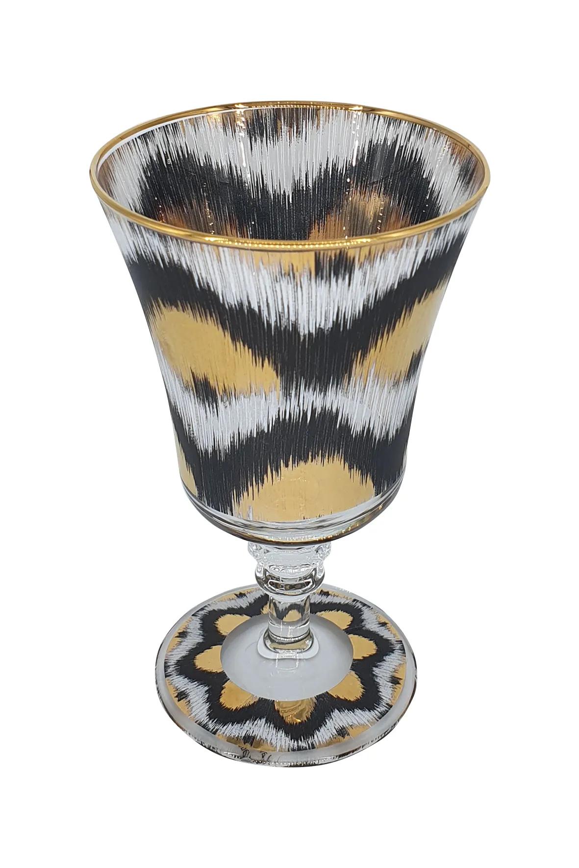 Elevate your table setting with our Ikat gold goblet glasses, blending modern design with timeless elegance. Featuring a delicate Ikat-inspired pattern and a luxurious gold finish, these goblets add a touch of sophistication to any occasion. Perfect