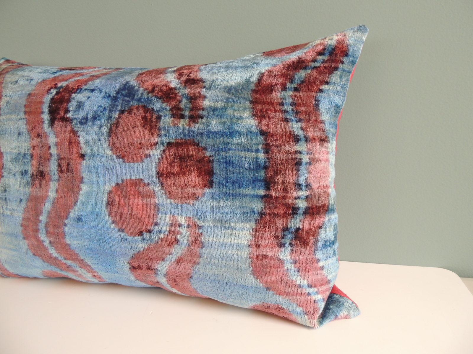 Ikat blue and pink decorative bolster pillow with hot pink linen backing.
Decorative pillow handcrafted and designed in the USA.
Closure by stitch (no zipper closure) with custom-made feather/Down pillow insert.
Size: 16