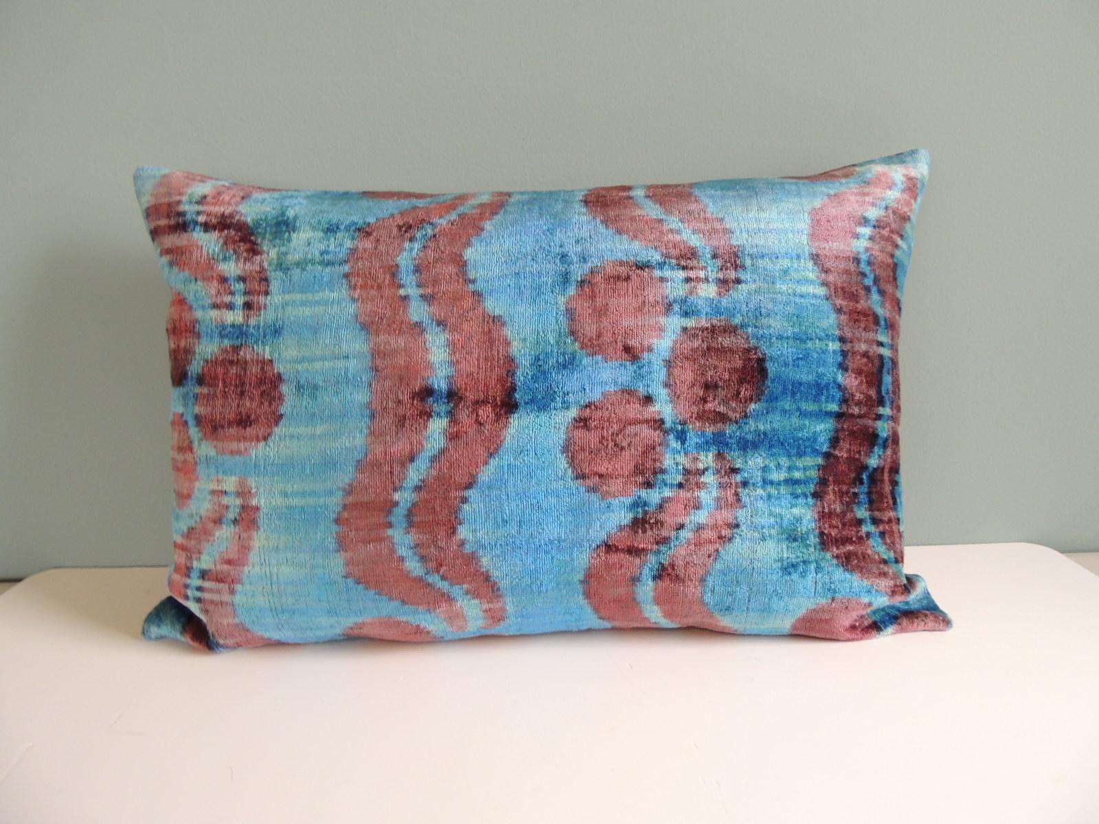 Ikat blue and pink decorative bolster pillow with hot pink linen backing.
Decorative pillow handcrafted and designed in the USA.
Closure by stitch (no zipper closure) with custom-made feather/Down pillow insert.
Size: 16