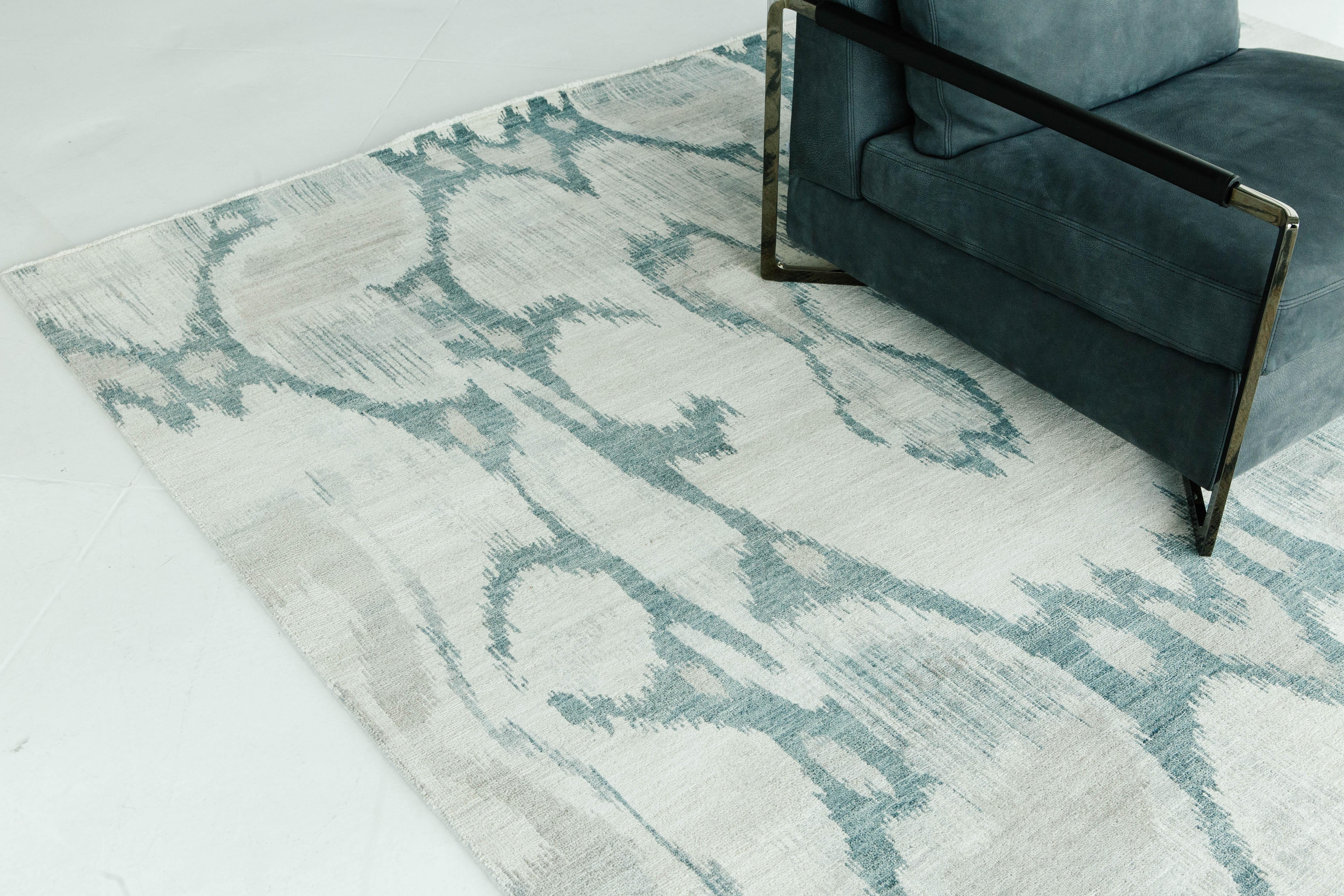 'Berja' is a beautiful magnified Ikat design rug in ivory, olive-taupe, and ocean blues. The colors work cohesively to bring about a calm yet invigorating design. Ikat designs are globally inspired for today's modern design world.


Rug Number