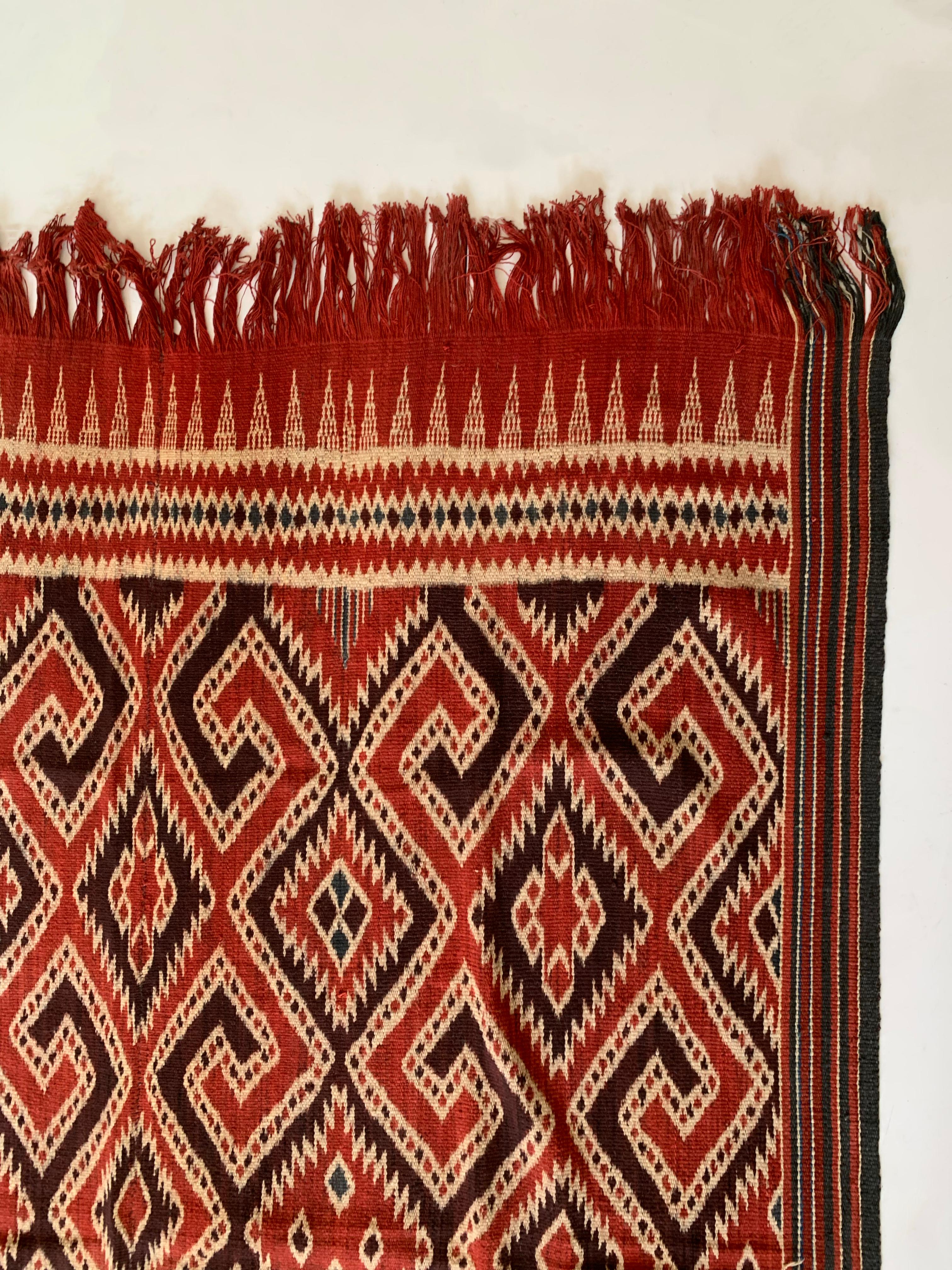 A very large Irate Textile from the Toraja tribes of Sulawesi, Indonesia. The Toraja tribes people are an ethnic and cultural group of people who occupy the mountainous highlands of South Sulawesi, Indonesia. Famous for their unique architecture and