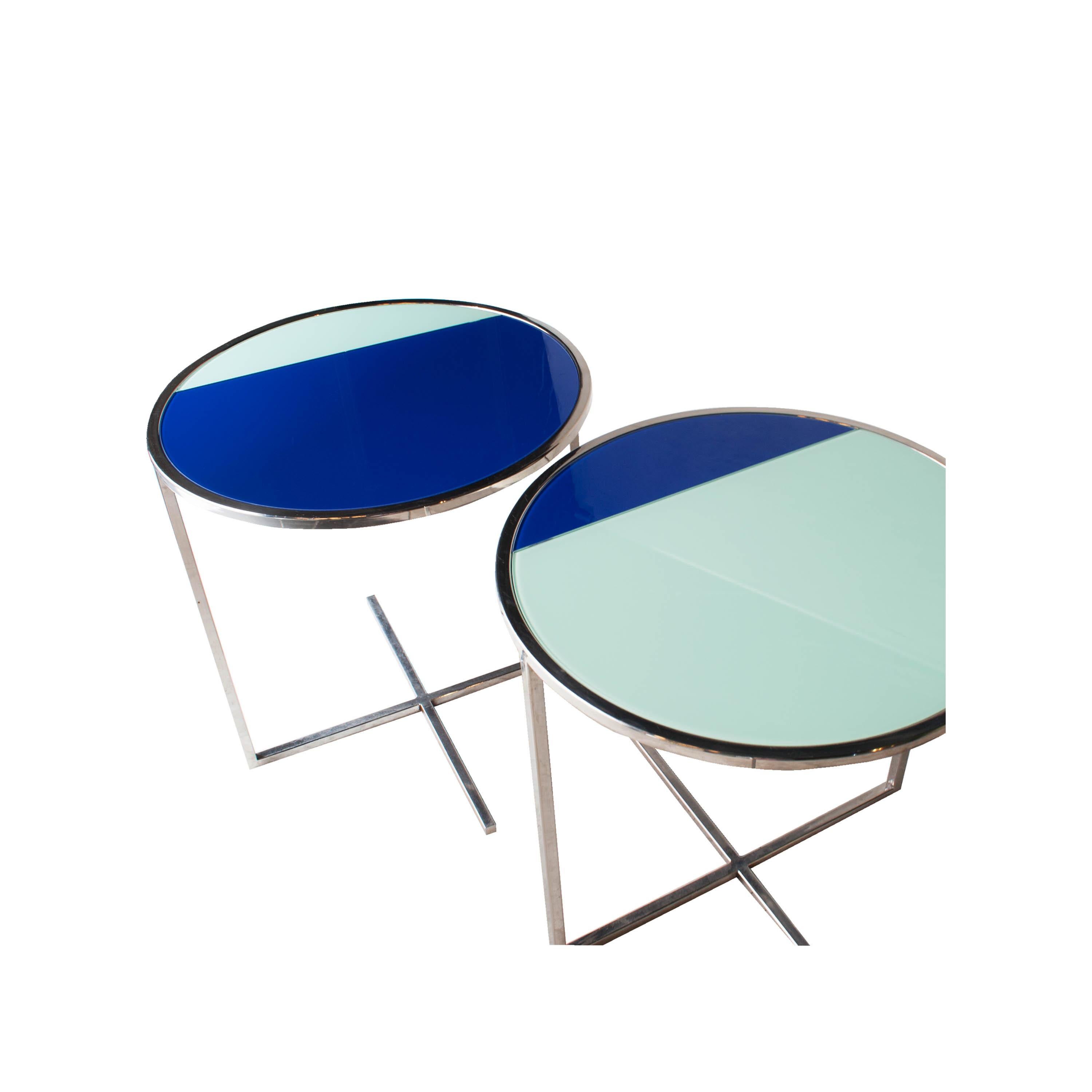 Circular coffee/centre table designed by IKB 191 Studio, with structure in chromed steel and glass Lacobel in different colors.
  