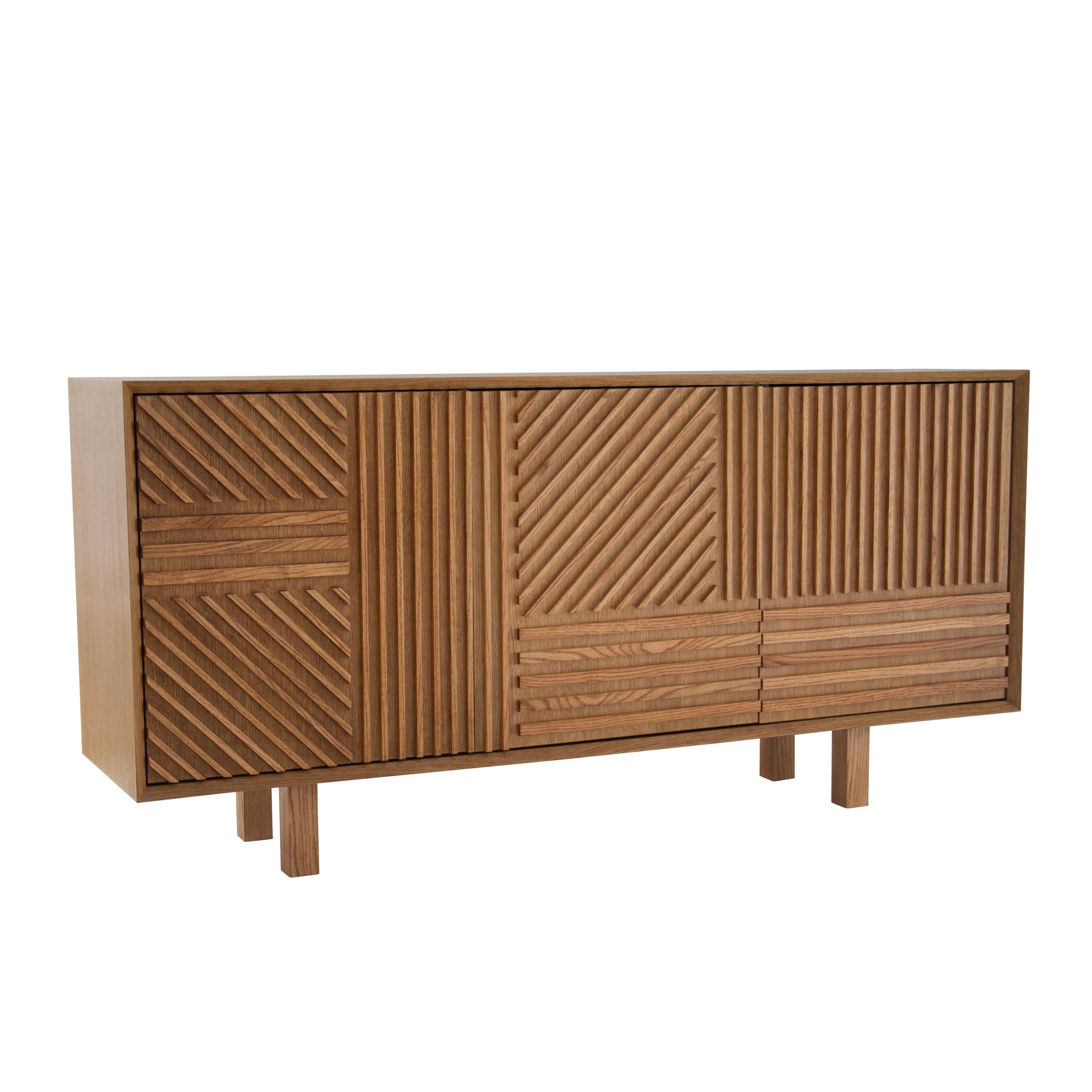 Sideboard designed by IKB 191 Madrid. Handcrafted piece made of oakwood. With three doors with slat fronts, and storage space inside.