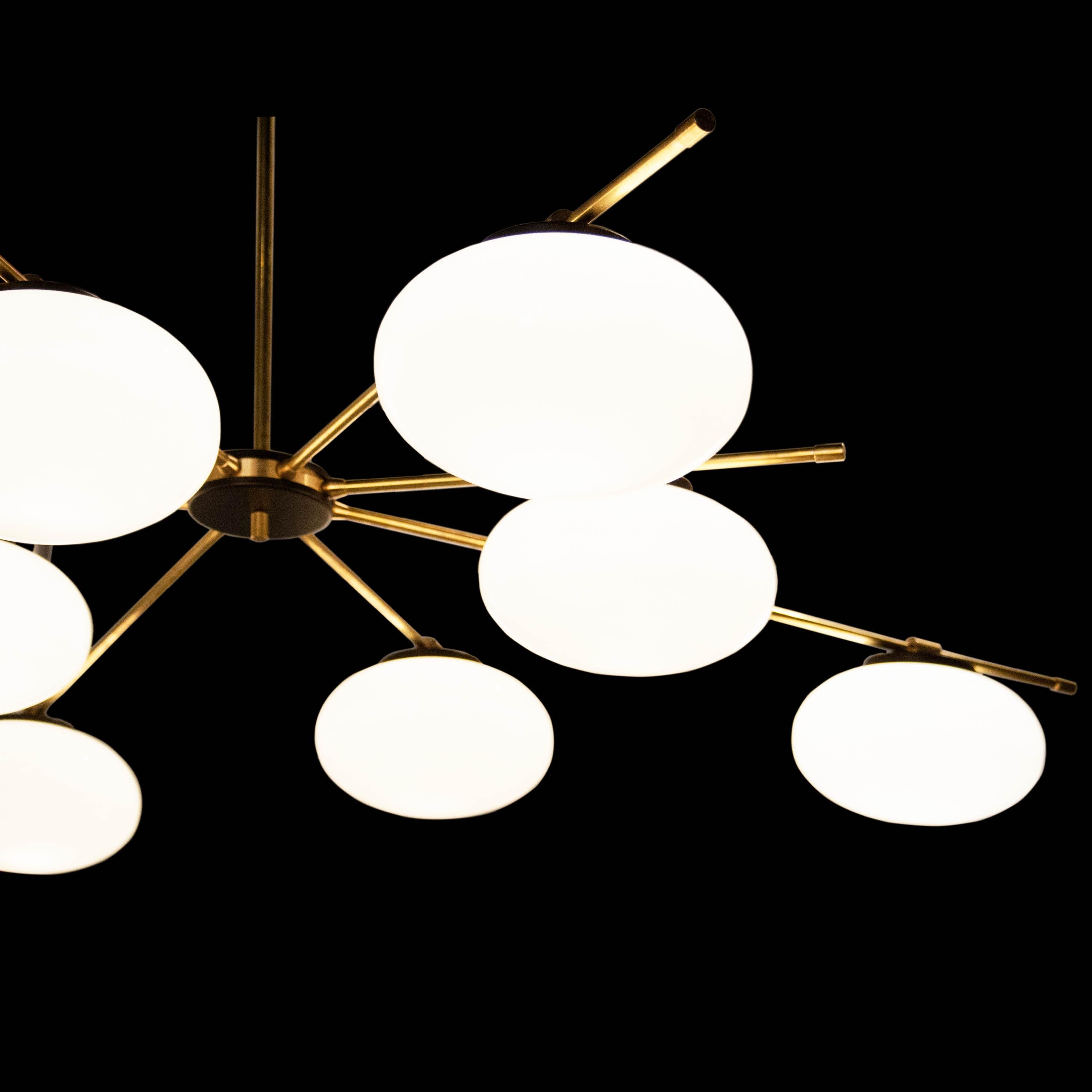 Contemporary suspension lamp, Stilnovo style edition, with brass structure, ended with white glass tulips. Designed by IKB191.