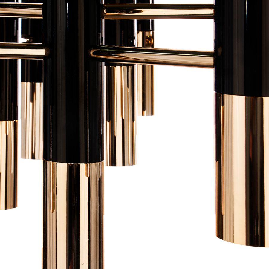 Ike suspension lamp has a distinctive but easily recognizable design, ideal for every single mid-century modern interior. With its clean lines, this dazzling lamp is handmade in brass and Aluminium, and it features a glossy black and gold plated
