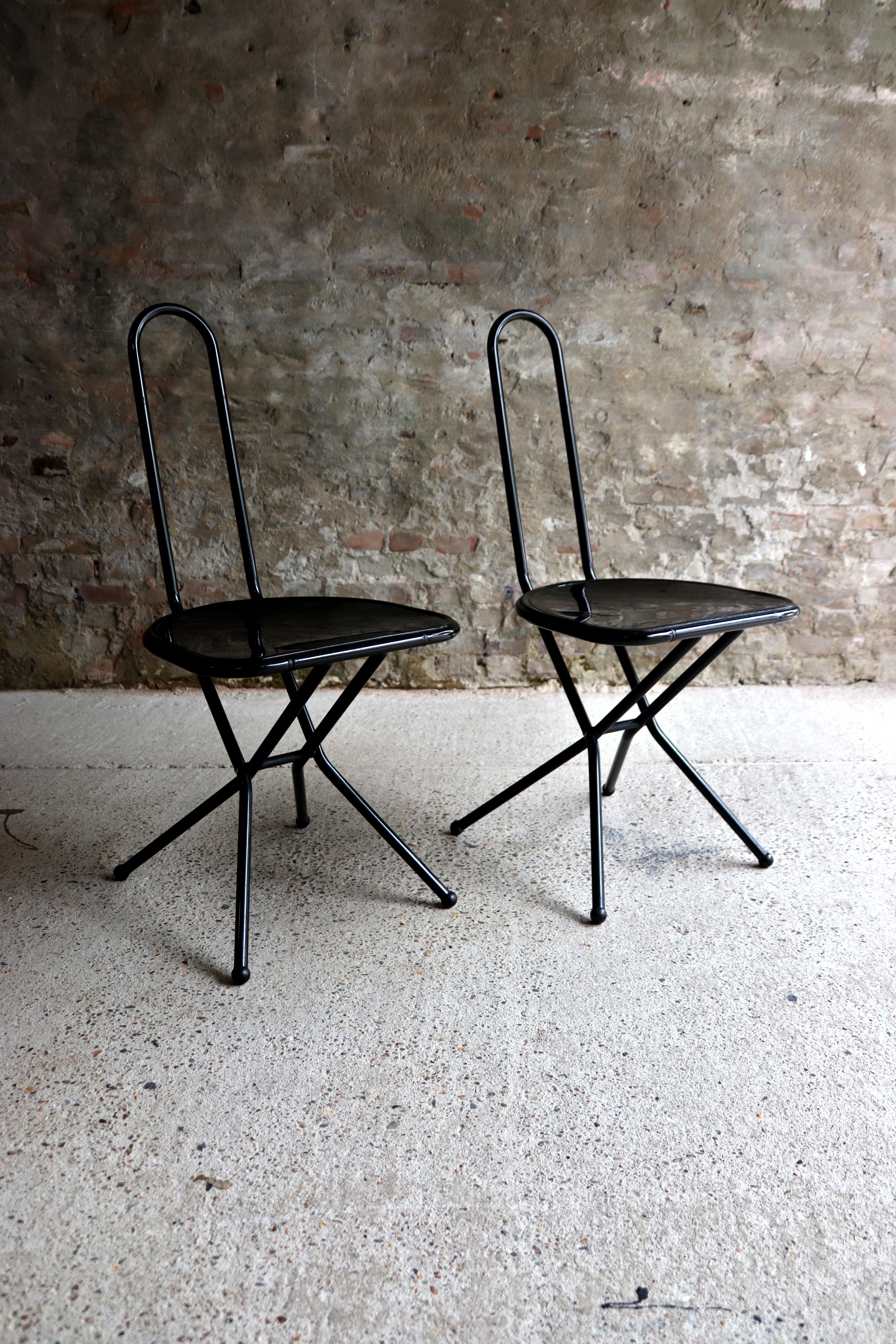 This folding chair is called Isak and is designed by Niels Gammelgaard for IKEA. It was first listed in the 1989 catalogue. Made in Italy. It has a black metal structure and black plexiglass seat. Isak chairs in this combination are really rare.