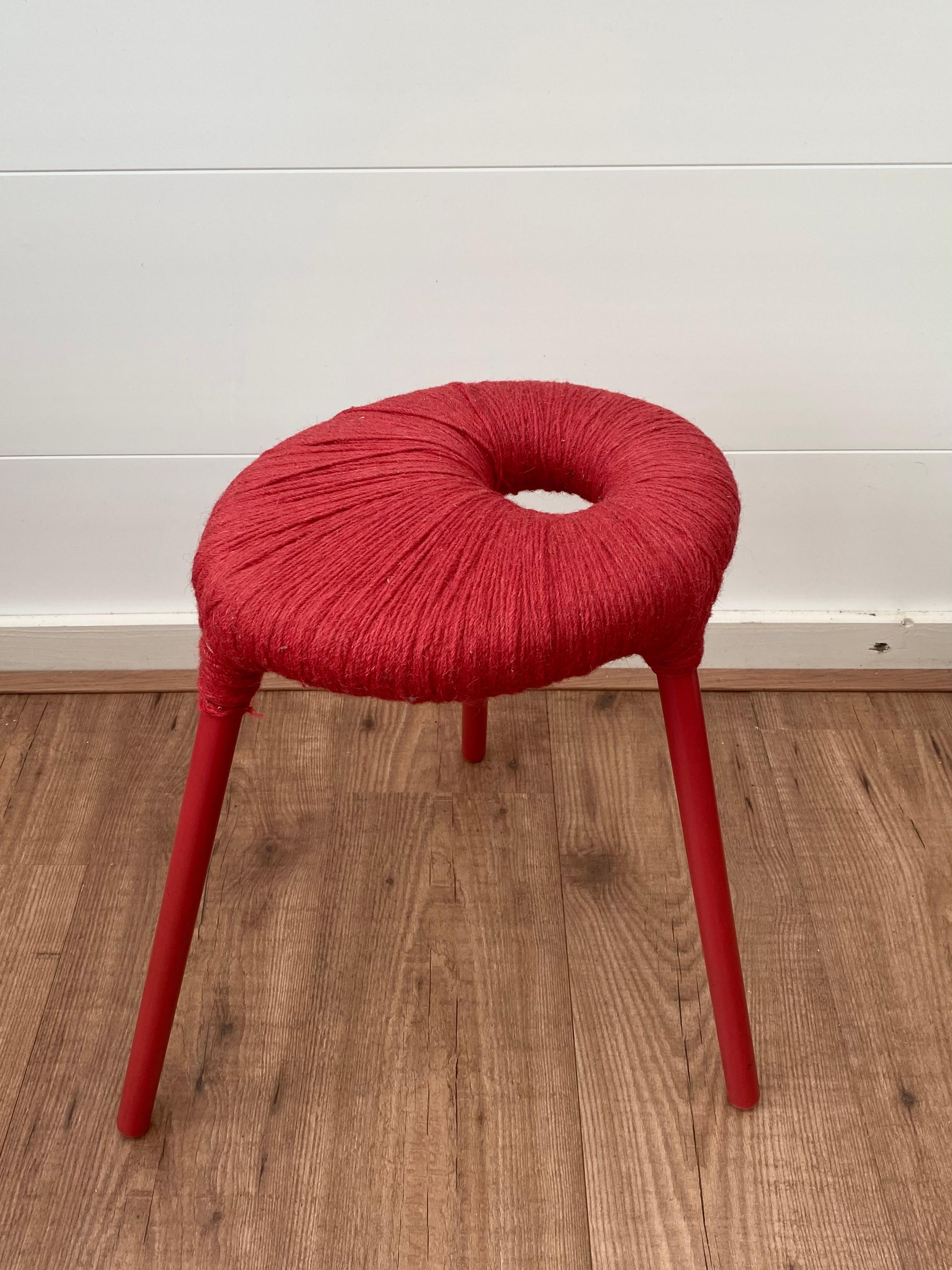 Scandinavian Modern stool, model Eskilstuna, from the Ikea PS series, 1999. The stool features a Red Lacquered Tubular Metal Base with a Red Wool Seating. The piece was Designed by Findlay, Graeme, McElroy and Carmen. 
While the stools were only