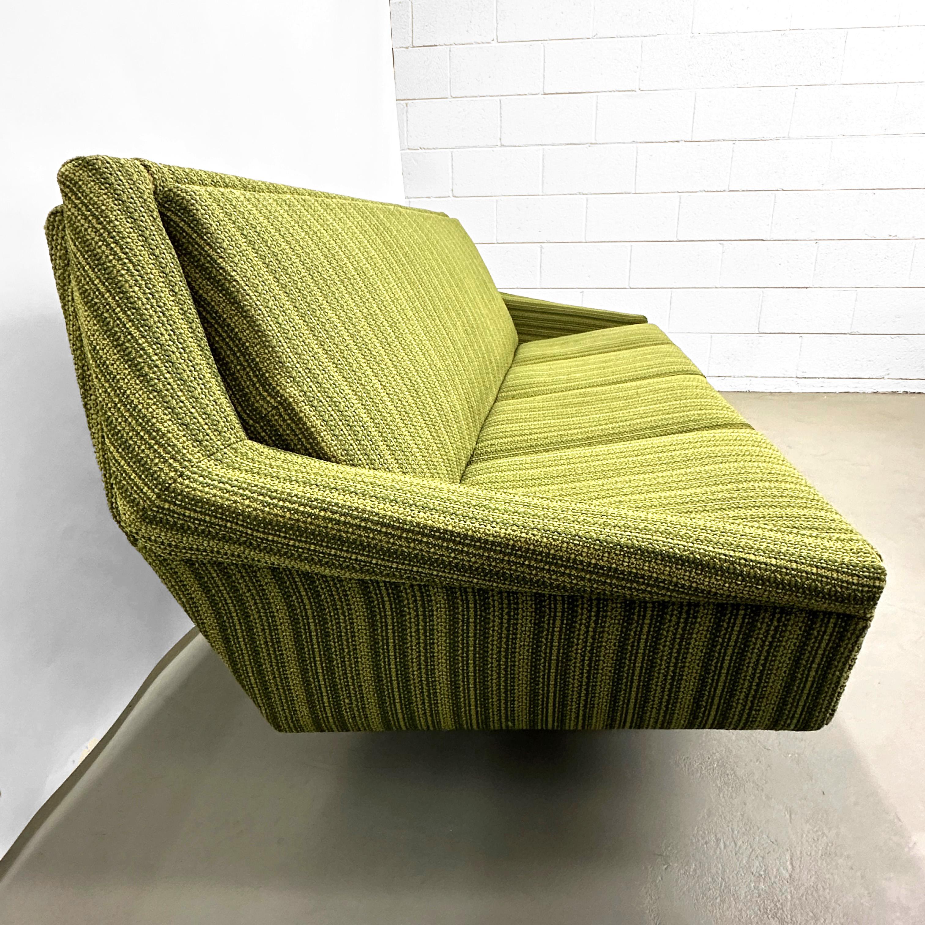Sofa by Bengt Ruda for IKEA. Sweden, 1961.

Original soft jute-like, textured weave upholstery in key lime and avocado stripes. The durable fabric is comfortable to the touch, and the solidly built frame remains in strong, sturdy condition, as well.