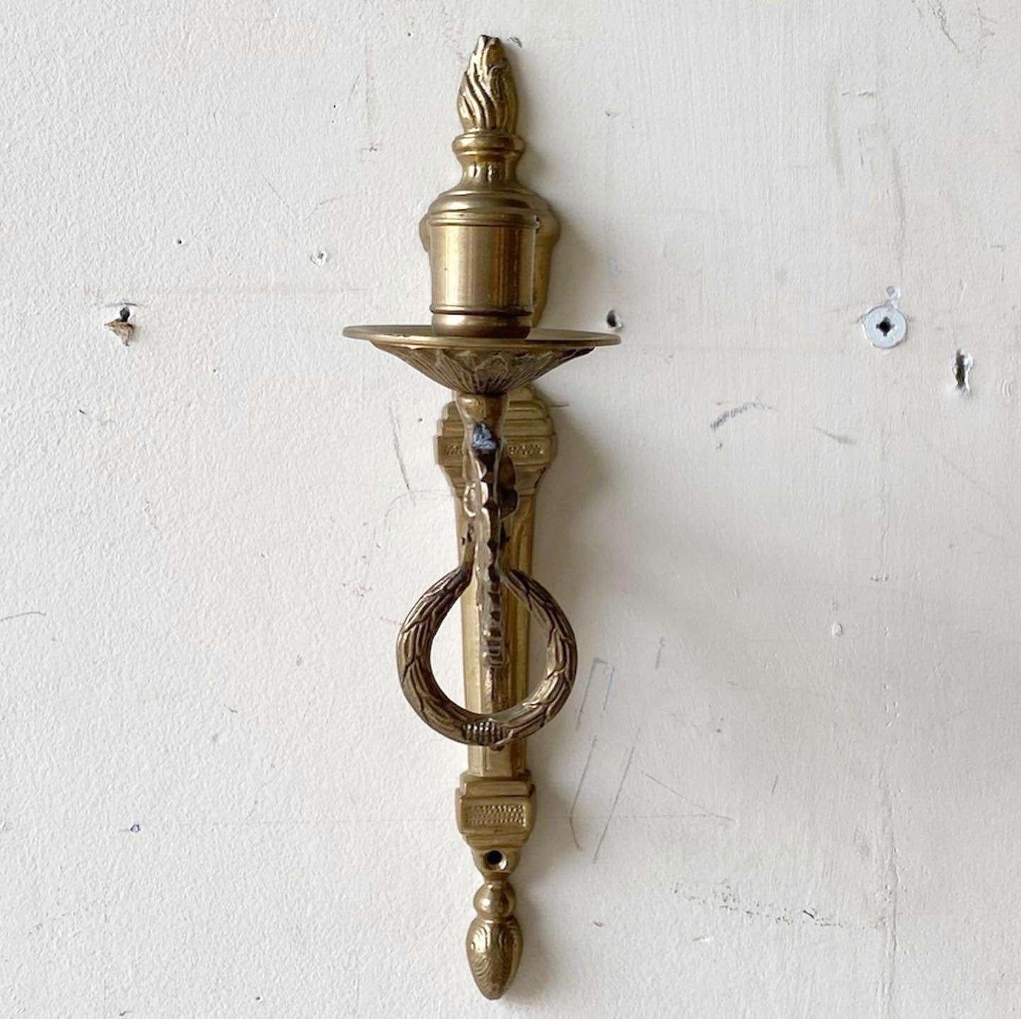 Amazing vintage IKEA wall sconce candle holder. Features an ornate design.
