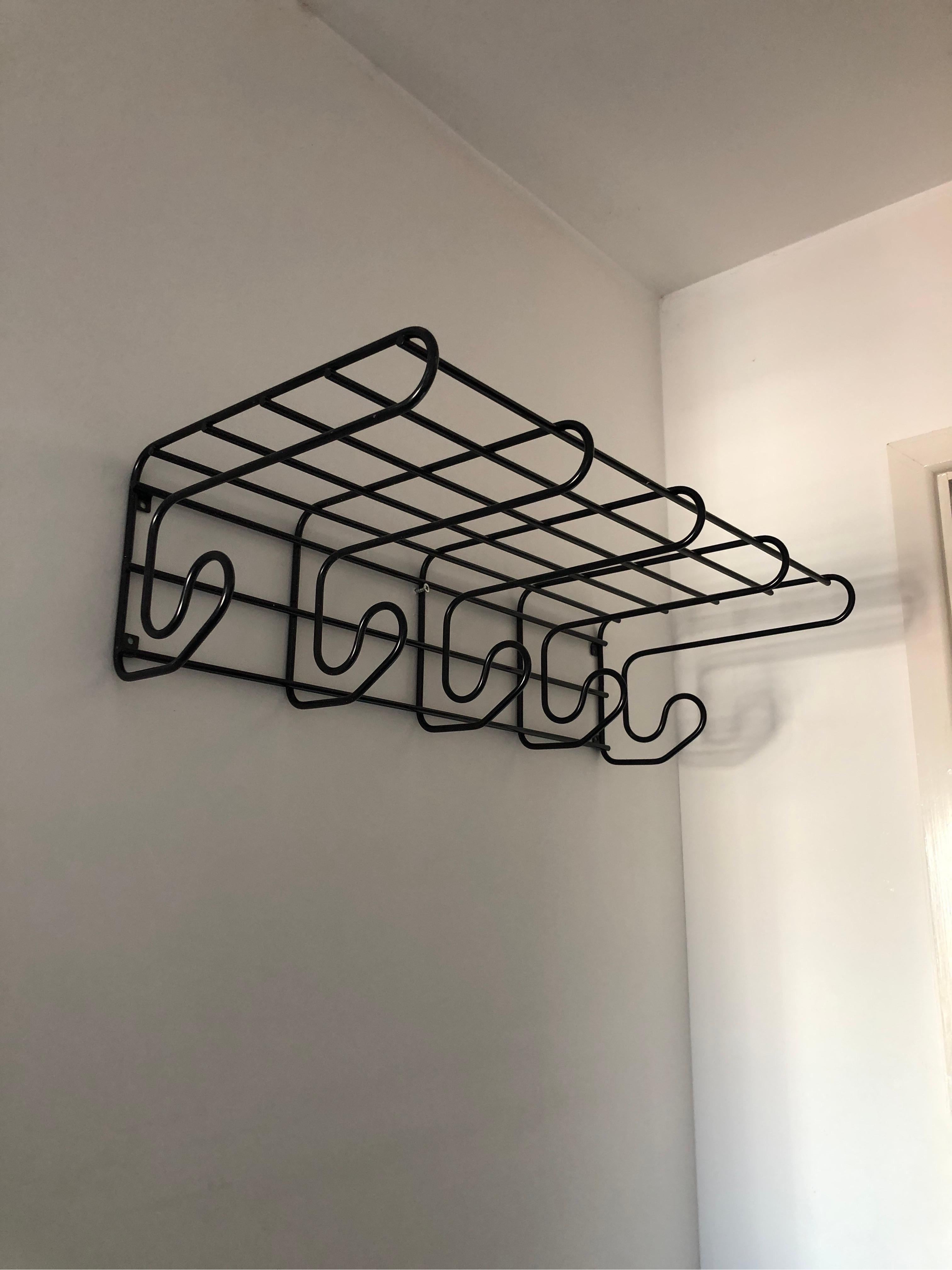 A 1980s postmodern coat and hat hanger with very graphic black linear look making it almost a cartoon looking piece. 
It would be great for lots of hallways or even bedrooms. 

Please contact us for international postage quotes. 

CREATOR:
