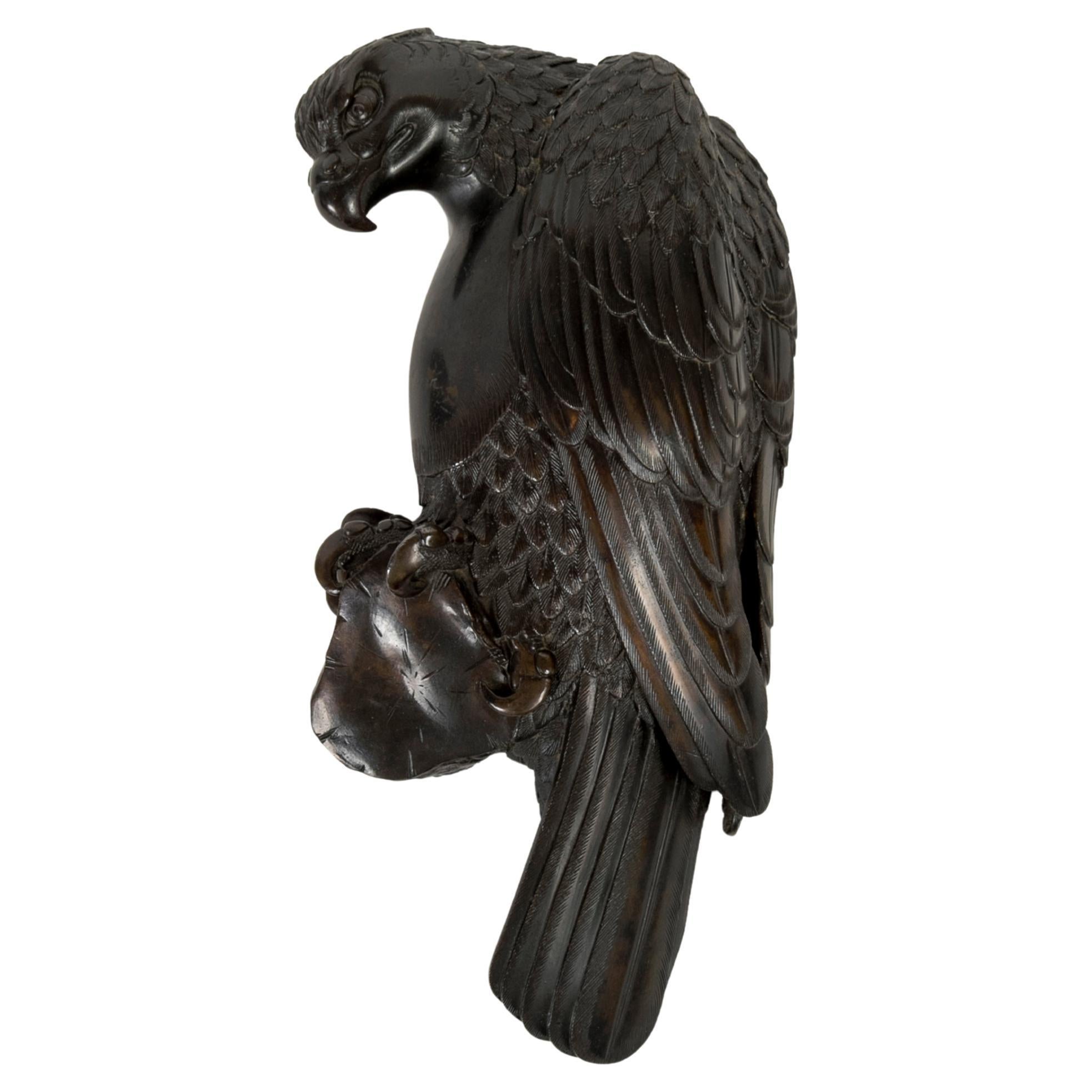 Ikebana in bronze of an Hawk designed to display flowers hanged on the wall