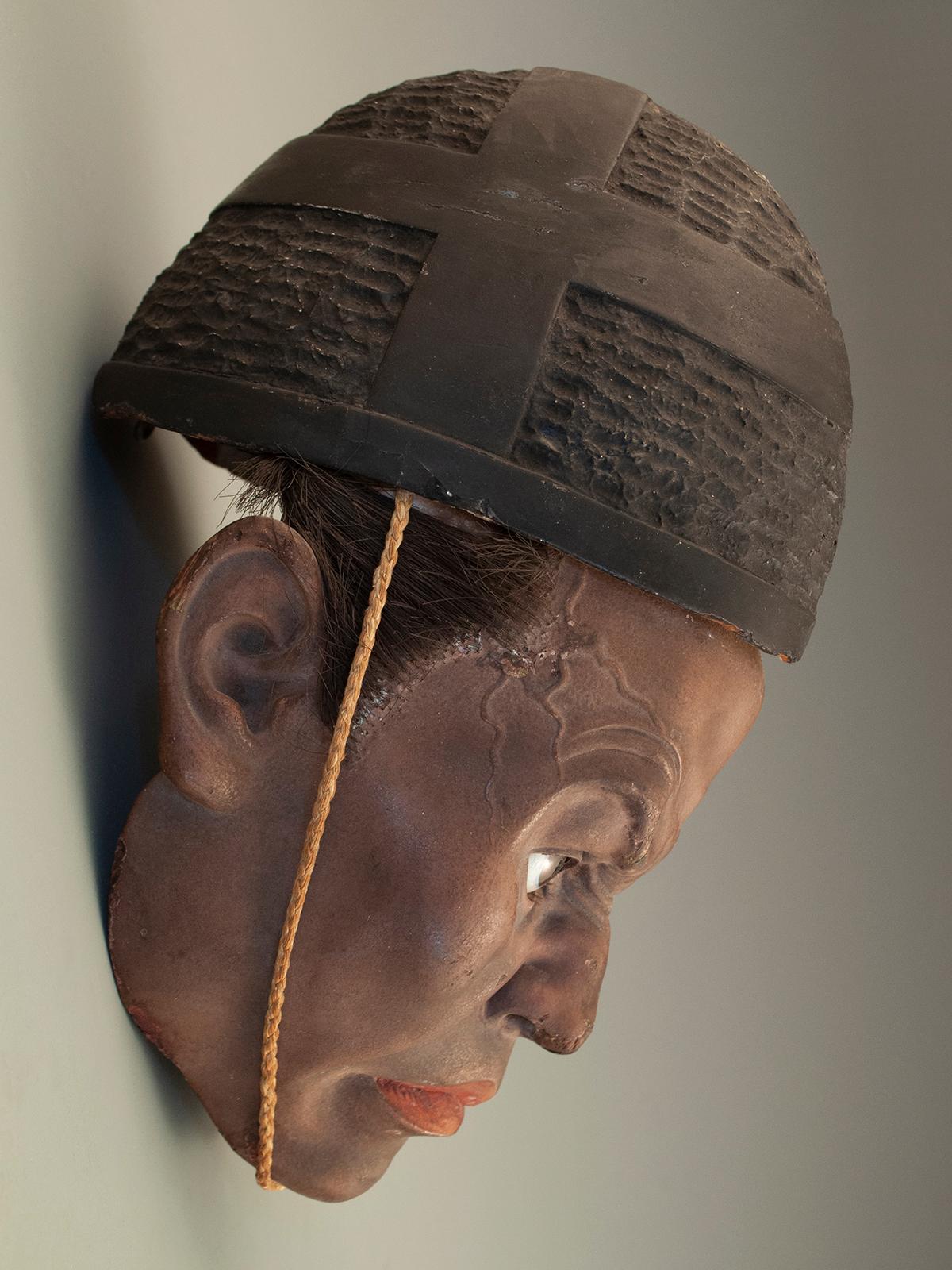 Iki Ningyo Face, Meiji Period, Japan
gofun, paint, glass eyes, animal hair 

This small, hyper-real iki-ningyo (living doll) face is masterfully carved from camphorwood, unlike the usual papier mâché versions. It was coated with a thin layer of