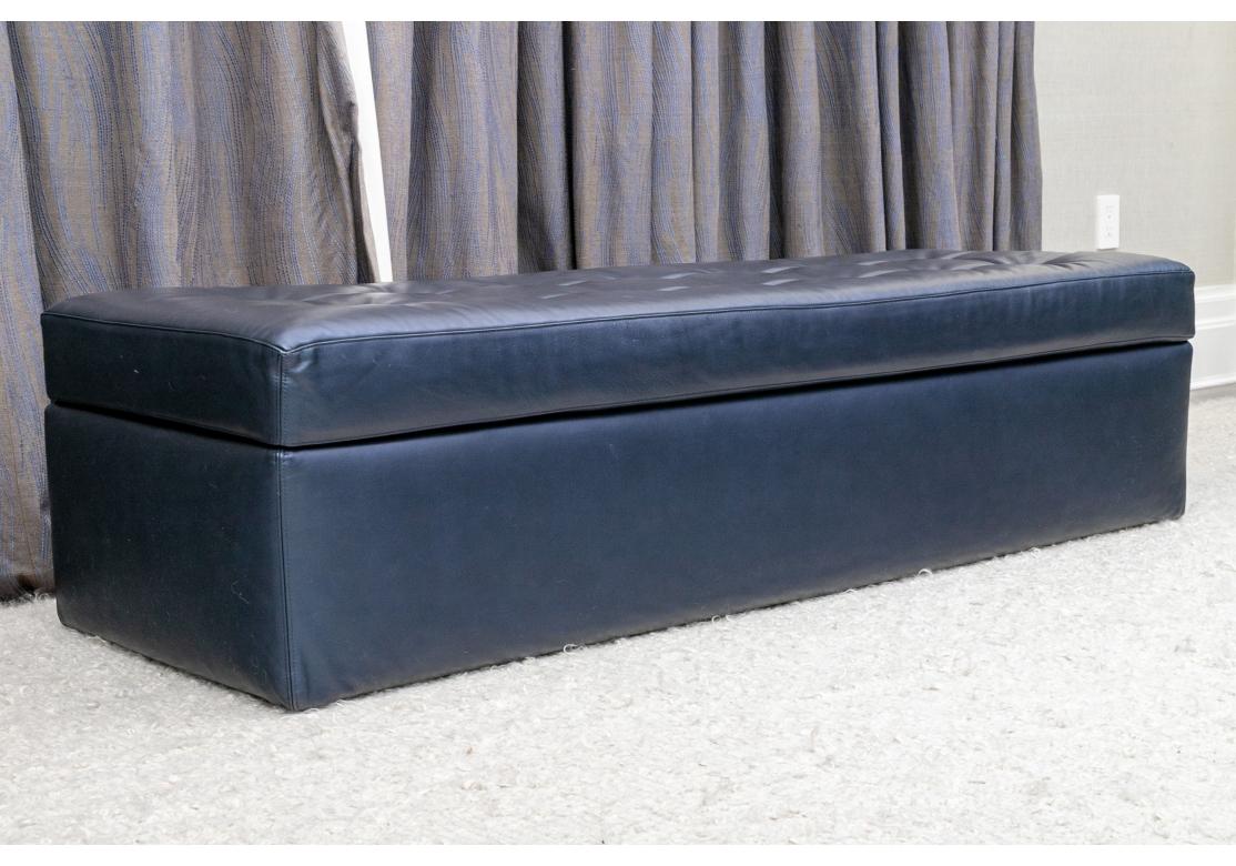 From the Iko Range of furniture by Italy’s iconic Flou. A Stylish long Storage Bench upholstered in beautifully stitched fine quality Navy Blue Leather. The Iko Bench has a Tufted top without buttons, quality chrome hardware and opens gently on