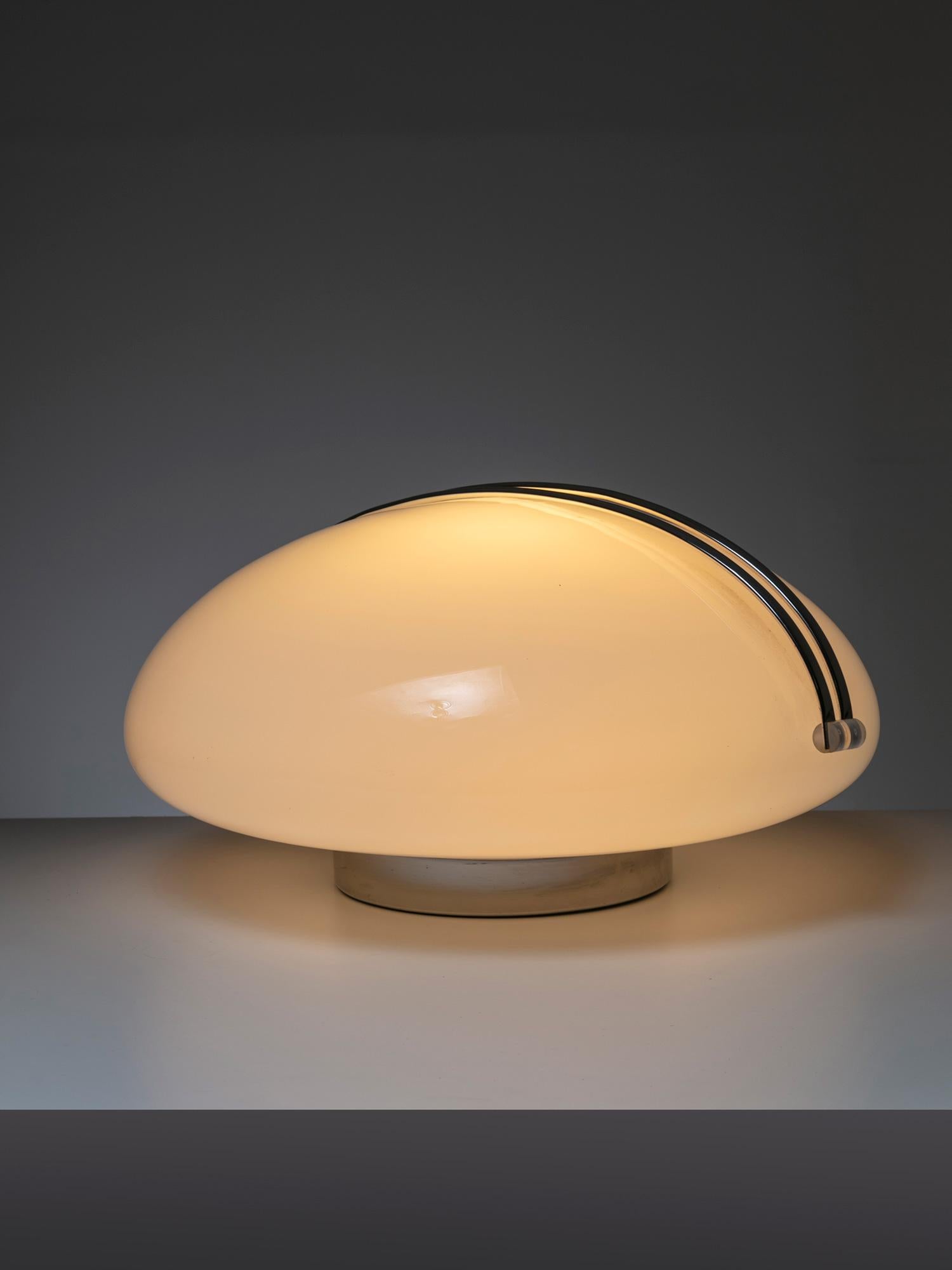 Il Cammino (The Road Ahead and the Road Back) table lamp by Angelo Mangiarotti for Iter Elettronica.
A opaline glass hill with a chrome path to follow. Adjustable light intensity activated by touching the metal element.