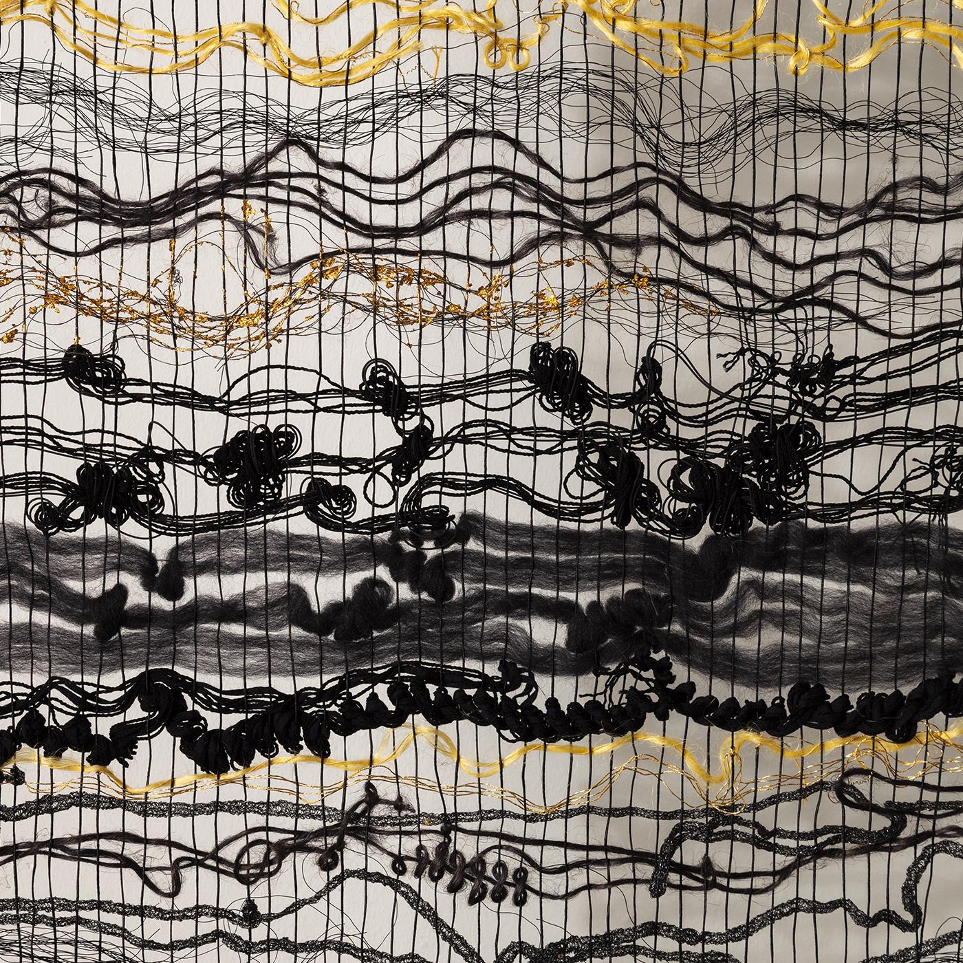 In a composition of linen, cotton, wool, polypropylene, polyester and brass foil applied with a gold leaf technique, this magnificent handwoven vertical tapestry seeks to represent a dialogue on the gift. woven using traditional techniques, the